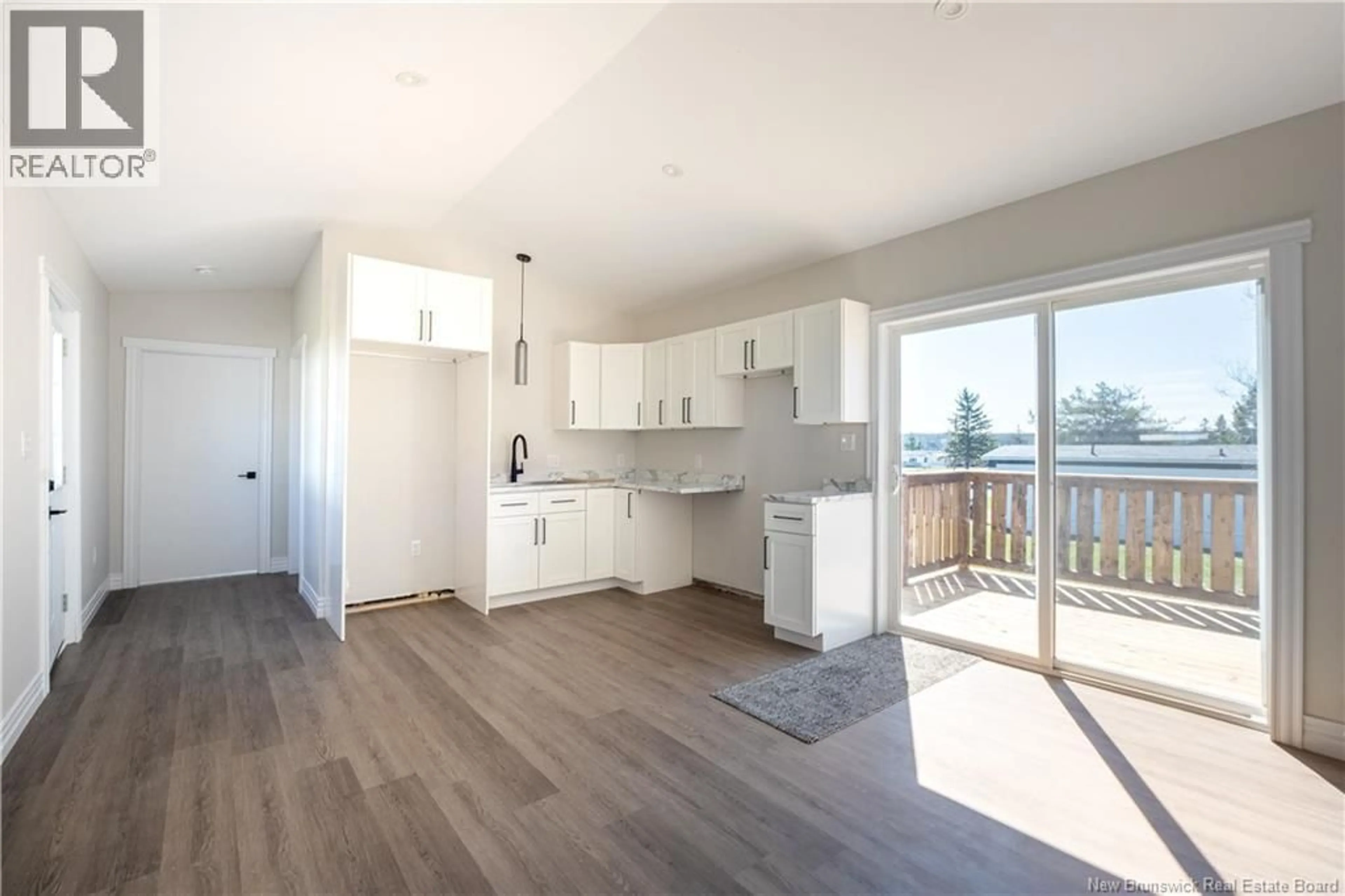 Open concept kitchen, wood/laminate floor for 32 CAROLYN CRESCENT, Moncton New Brunswick E1E3T6