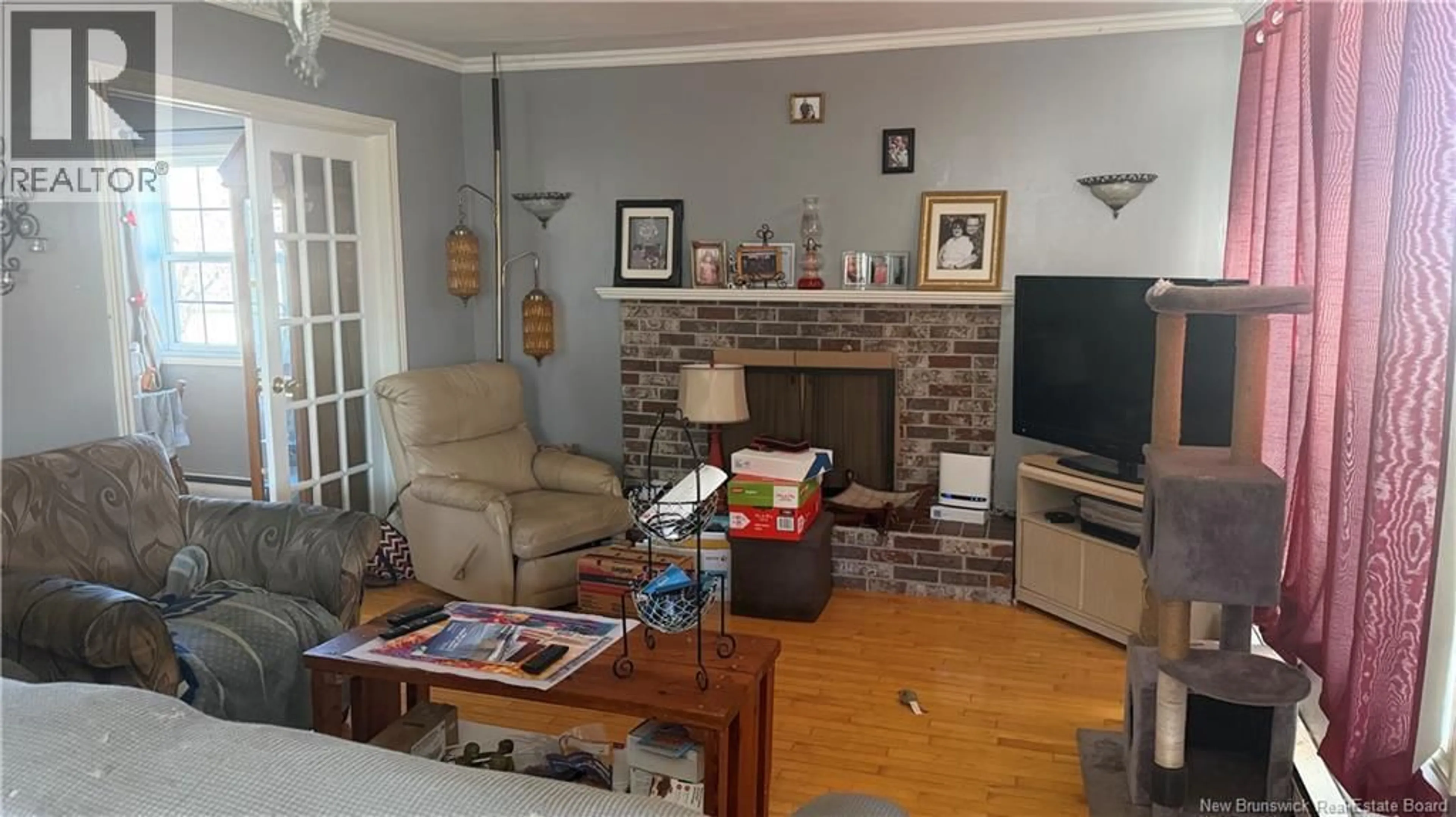 Living room with furniture, wood/laminate floor for 22 CEDAR STREET, Moncton New Brunswick E1C7L2