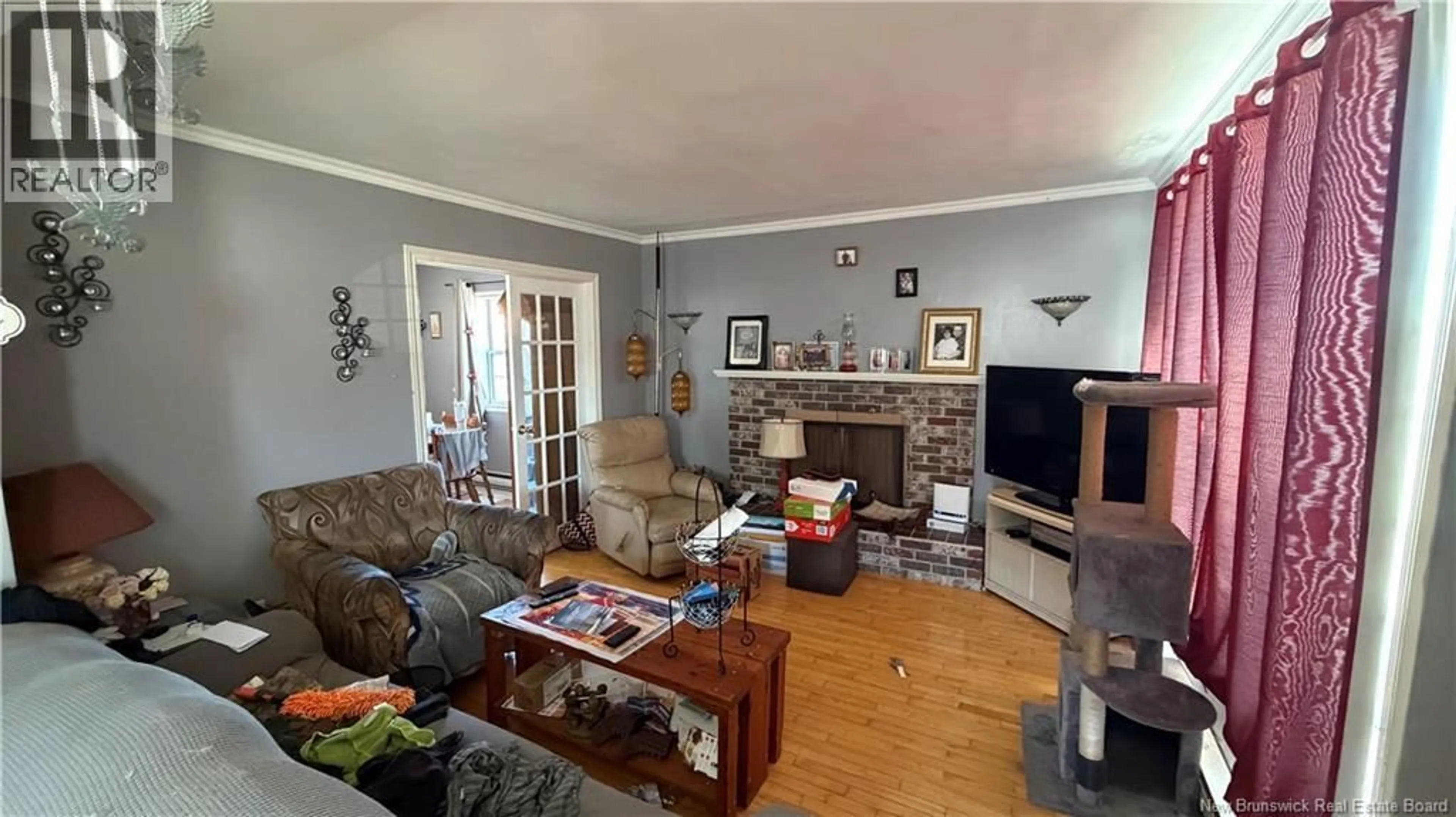 Living room with furniture, wood/laminate floor for 22 CEDAR STREET, Moncton New Brunswick E1C7L2