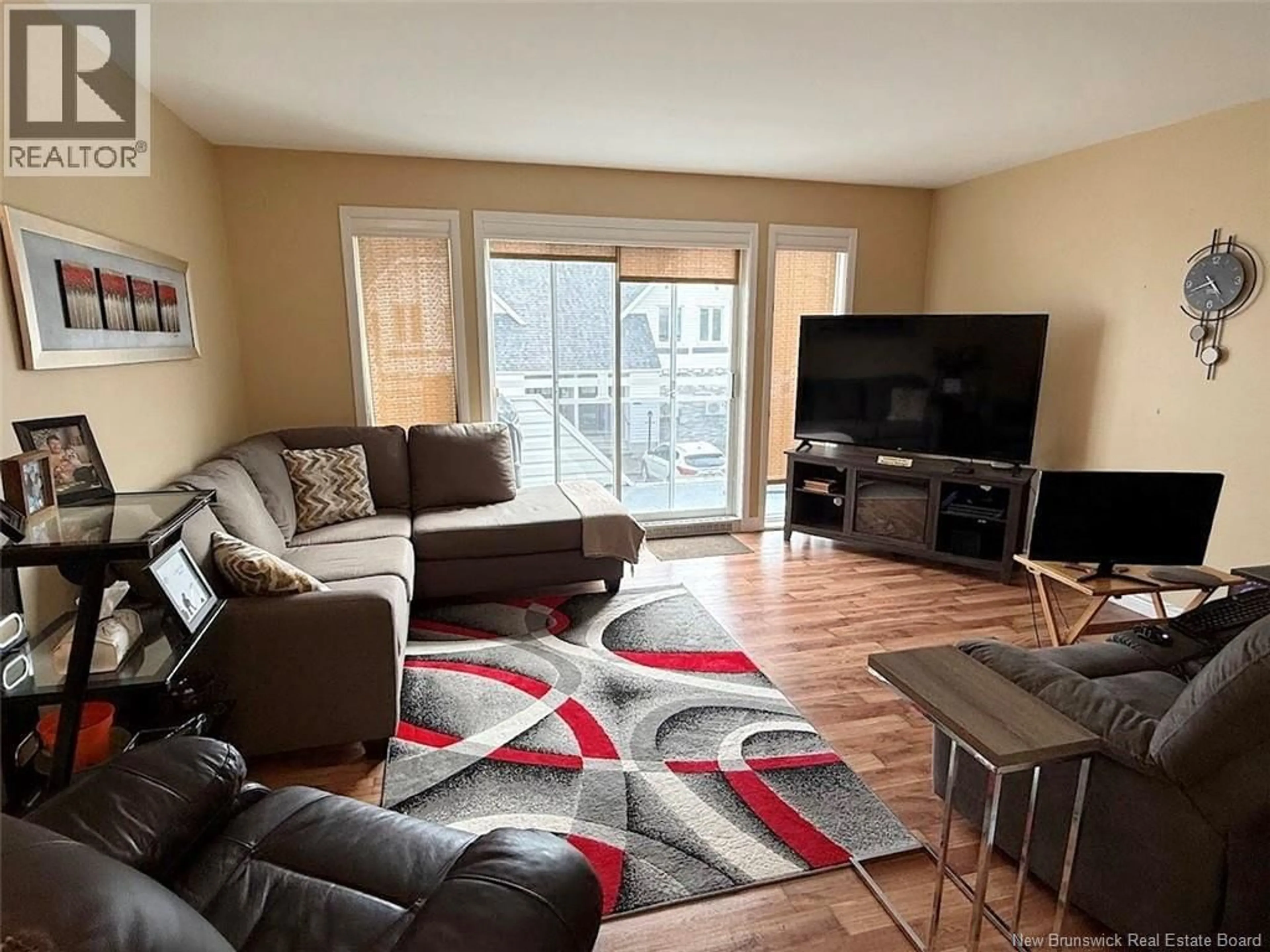 Living room with furniture, wood/laminate floor for G - 20 DU BOURG AVENUE, Edmundston New Brunswick E3V4C5