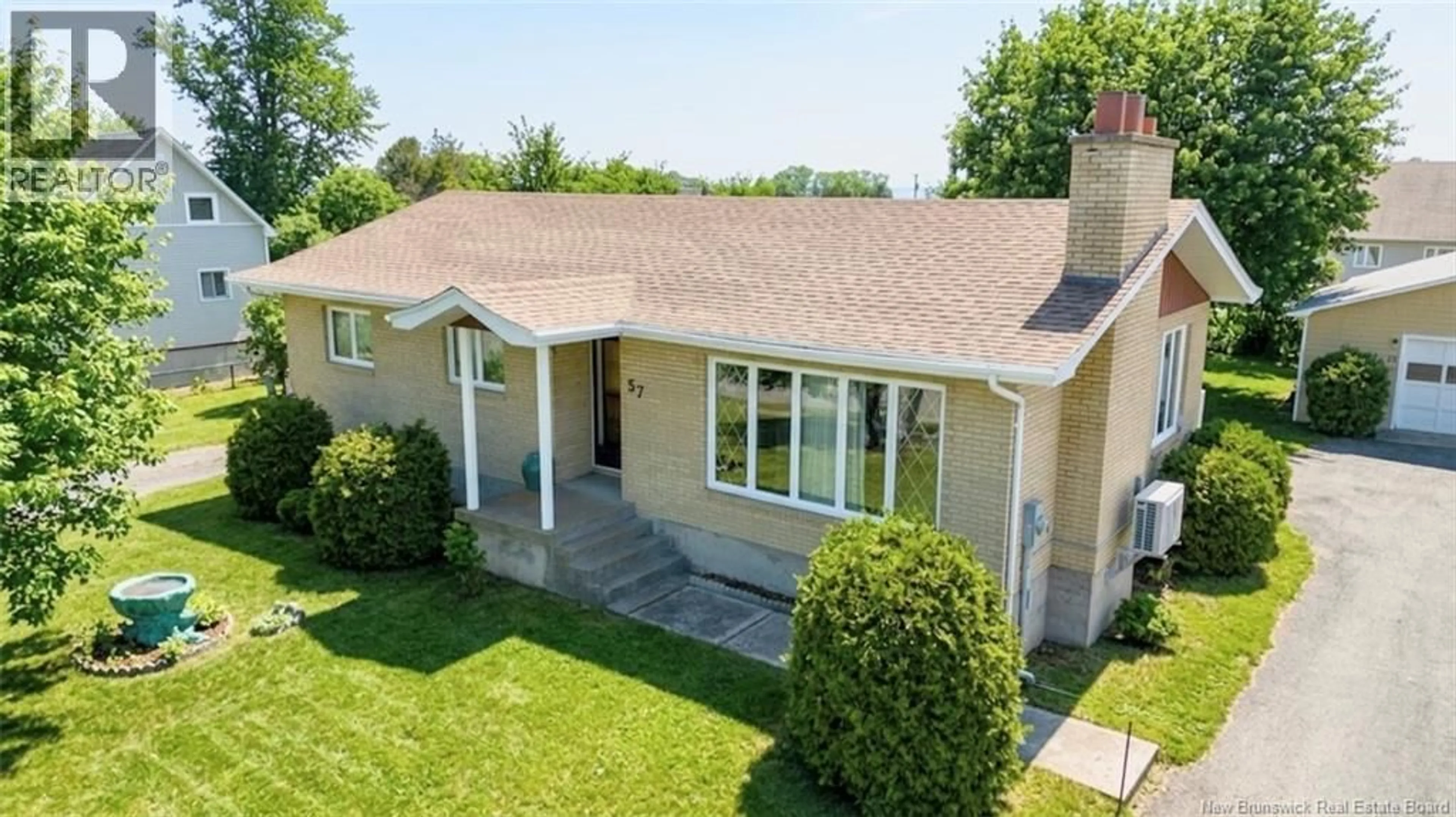 A pic from outside/outdoor area/front of a property/back of a property/a pic from drone, street for 57 RUE L'ANGLAIS, Petit-Rocher New Brunswick E8J1J1
