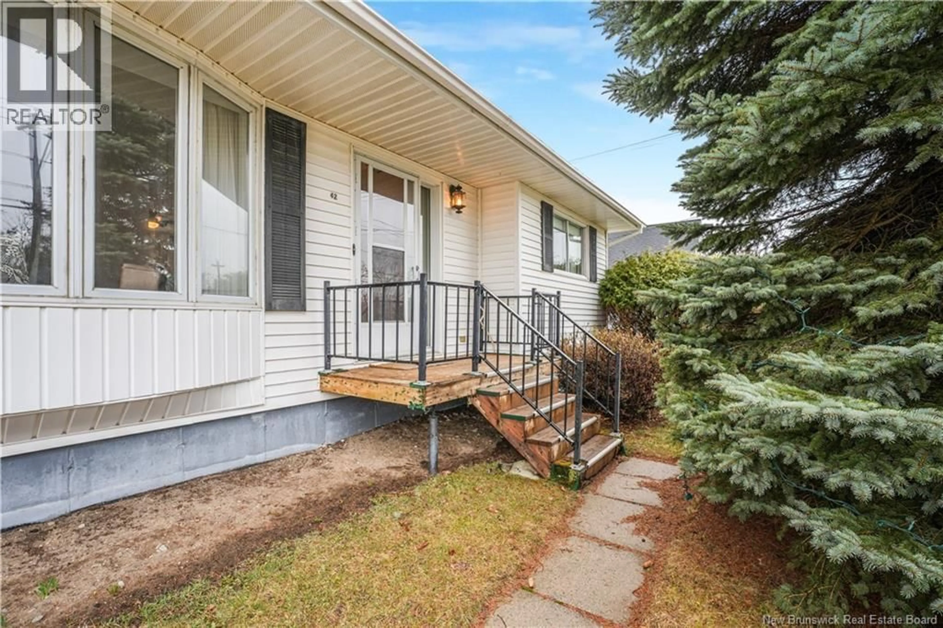 Home with vinyl exterior material, street for 42 RIVER STREET, Fredericton New Brunswick E3A4L7