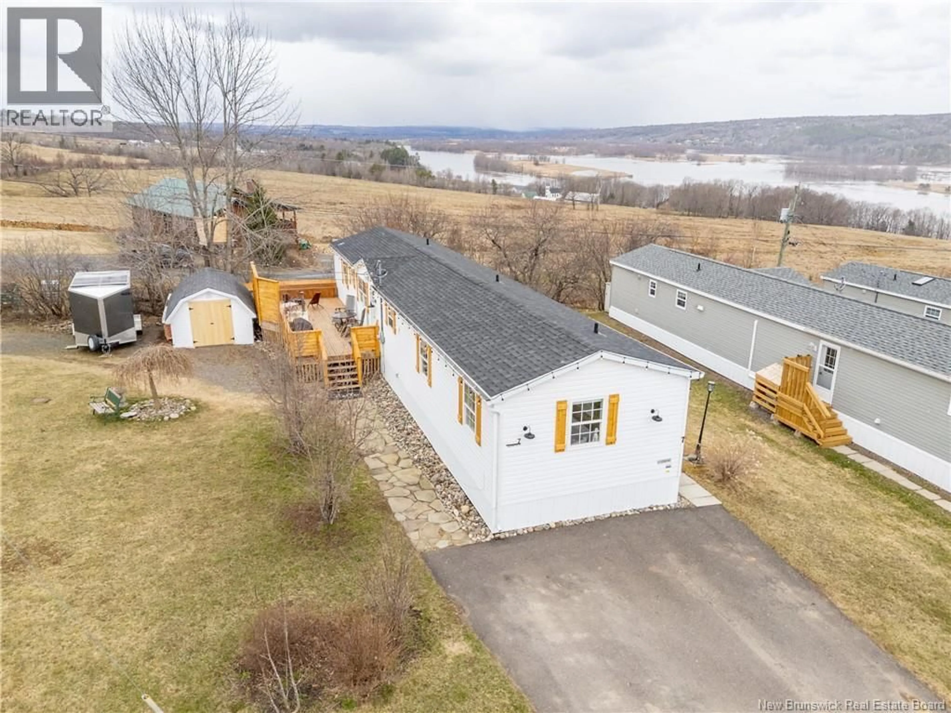 A pic from outside/outdoor area/front of a property/back of a property/a pic from drone, water/lake/river/ocean view for 7 BARRINGTON ROAD, Fredericton New Brunswick E3C0A5