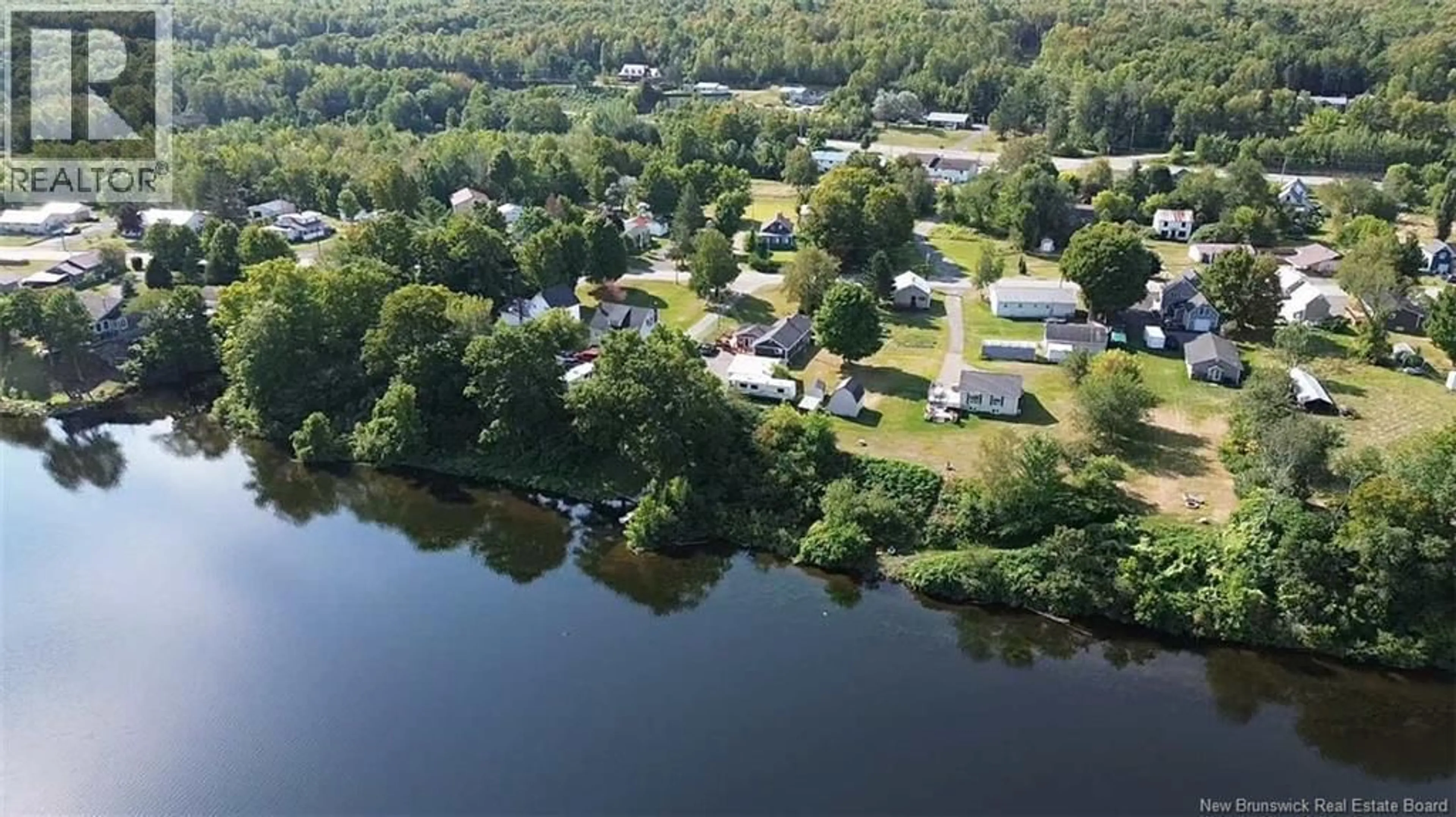 A pic from outside/outdoor area/front of a property/back of a property/a pic from drone, water/lake/river/ocean view for 55 MAIN STREET, Meductic New Brunswick E6H1E3