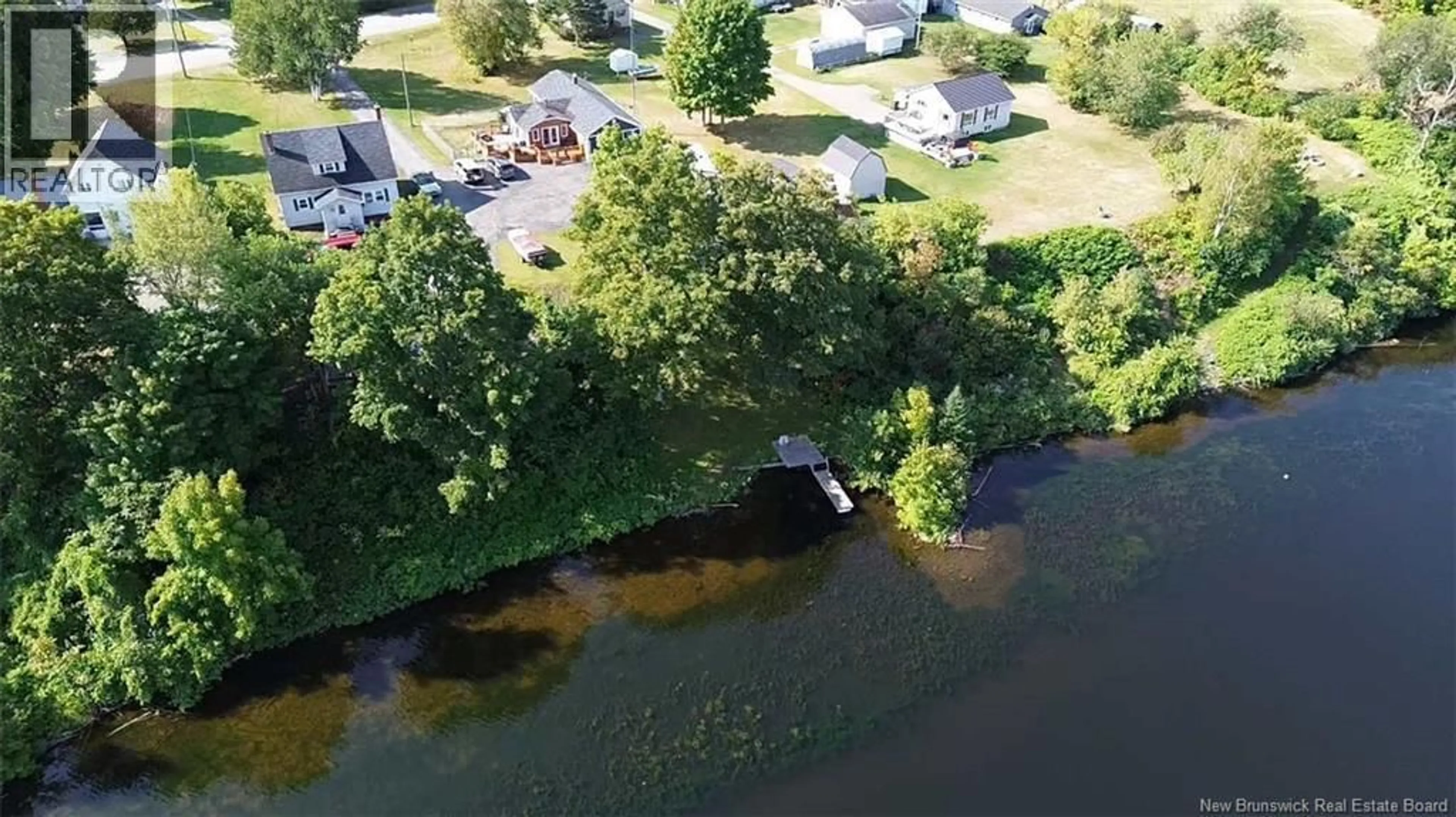 A pic from outside/outdoor area/front of a property/back of a property/a pic from drone, water/lake/river/ocean view for 55 MAIN STREET, Meductic New Brunswick E6H1E3