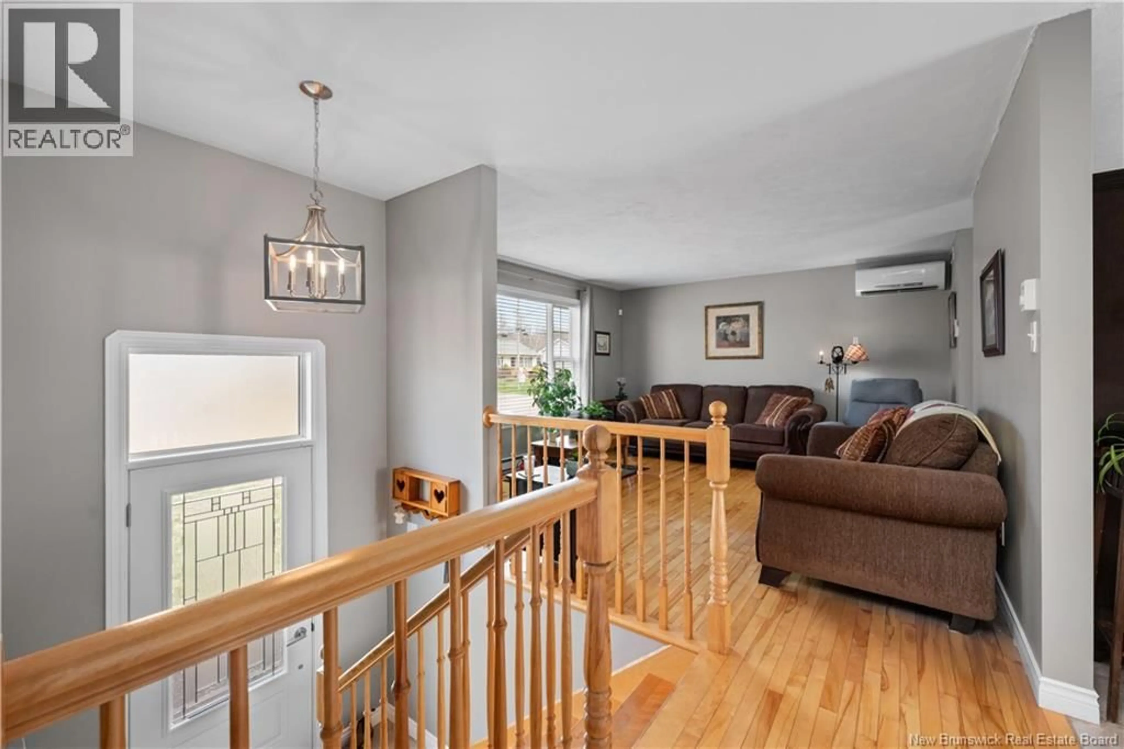 Living room with furniture, wood/laminate floor for 75 ANIK, Dieppe New Brunswick E1A7S1