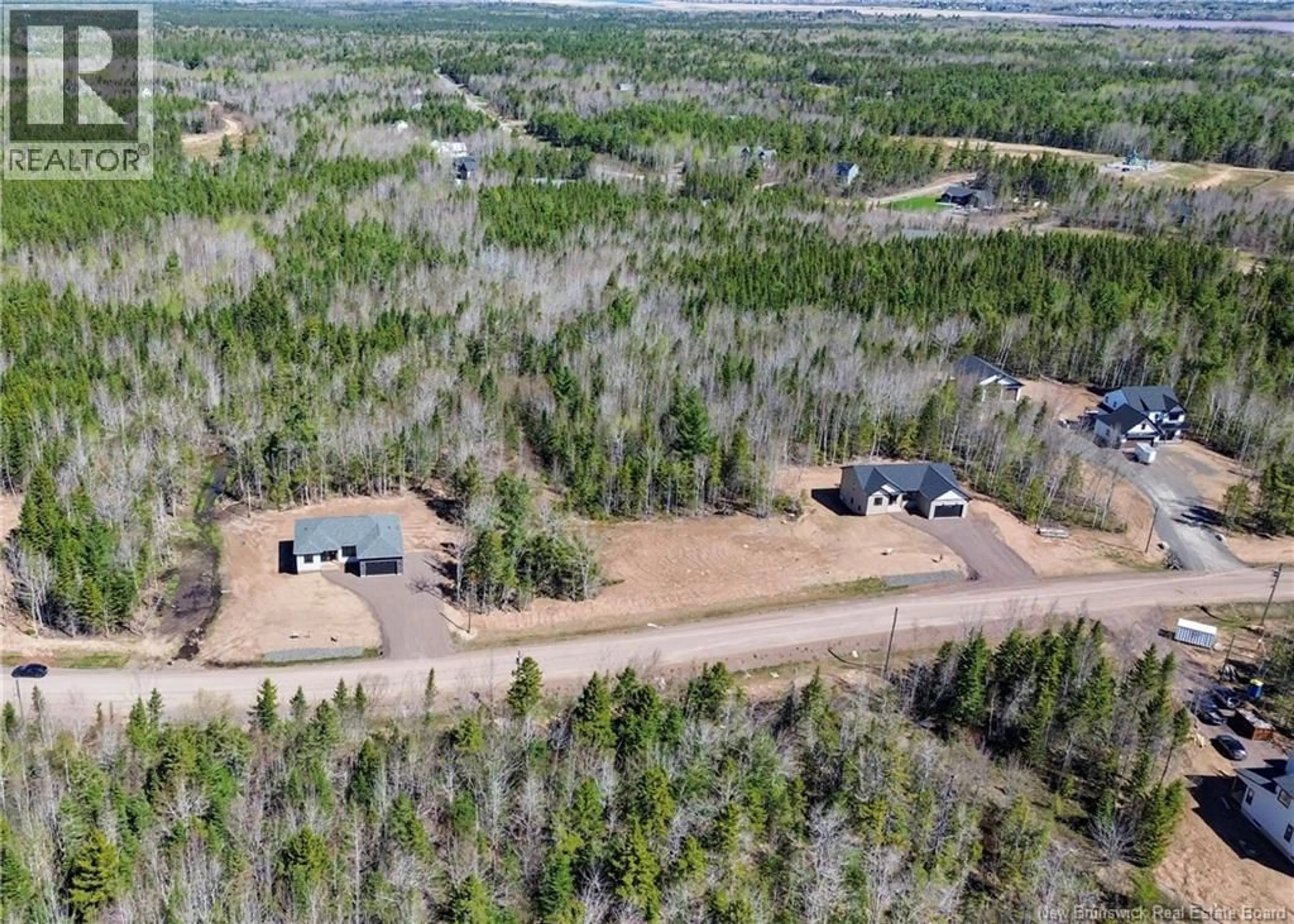 A pic from outside/outdoor area/front of a property/back of a property/a pic from drone, forest/trees view for 38 MAEFIELD STREET, Lower Coverdale New Brunswick E1J0E7