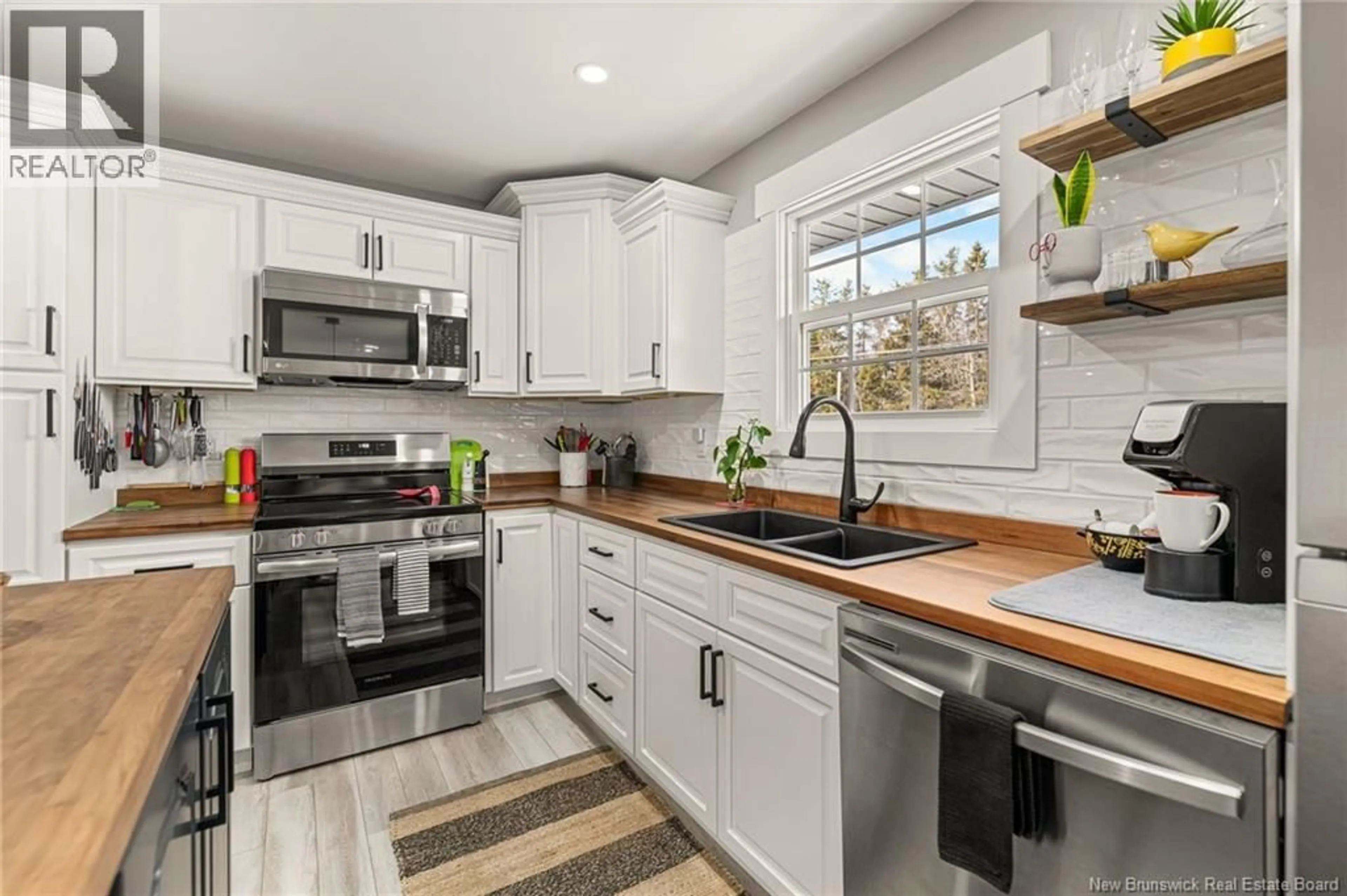 Open concept kitchen, ceramic/tile floor for 303 SAINT CHARLES SUD, Saint-Charles New Brunswick E4W4V5