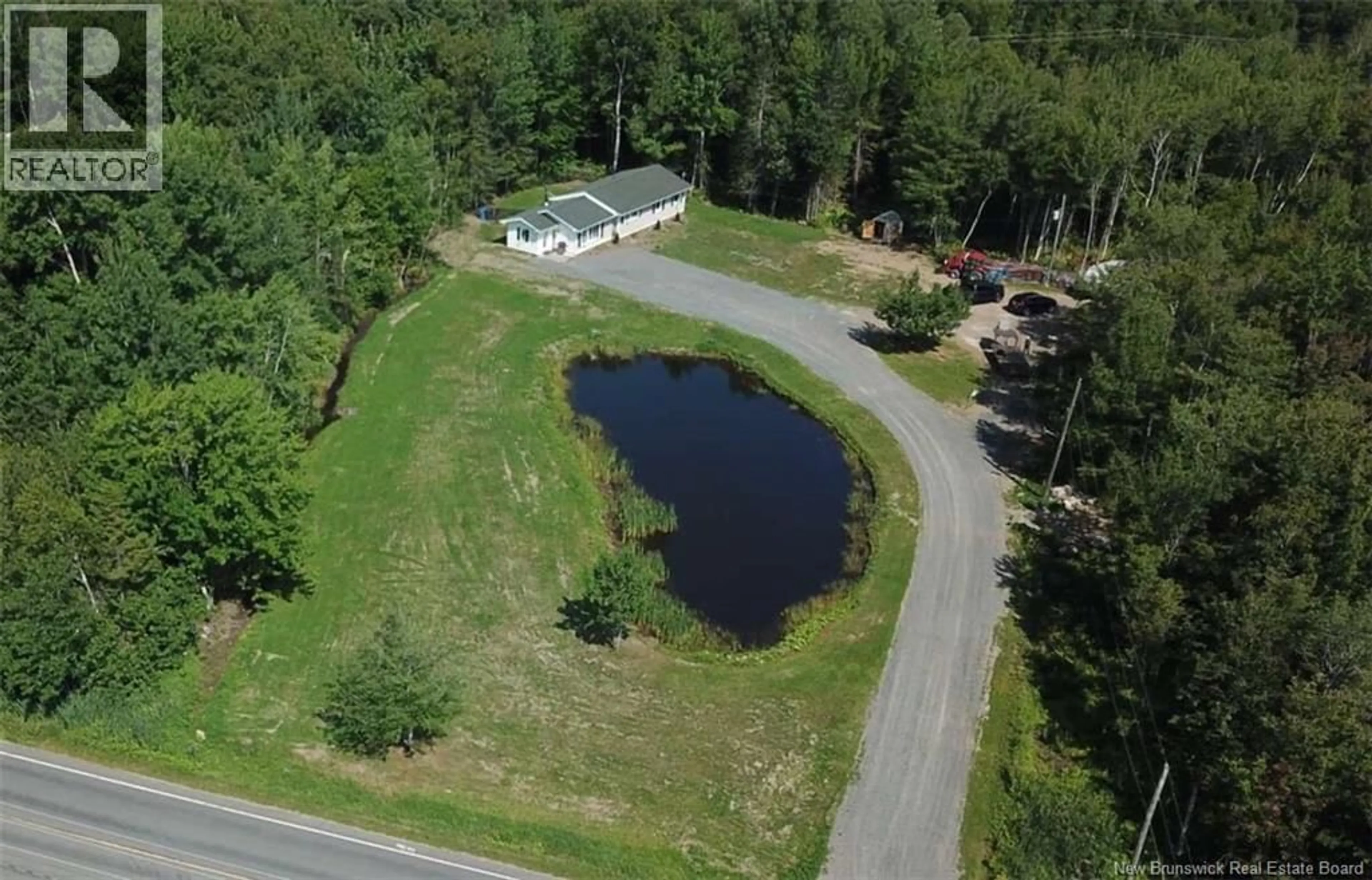 A pic from outside/outdoor area/front of a property/back of a property/a pic from drone, water/lake/river/ocean view for 922 ROBERTVILLE, Robertville New Brunswick E8K2K5