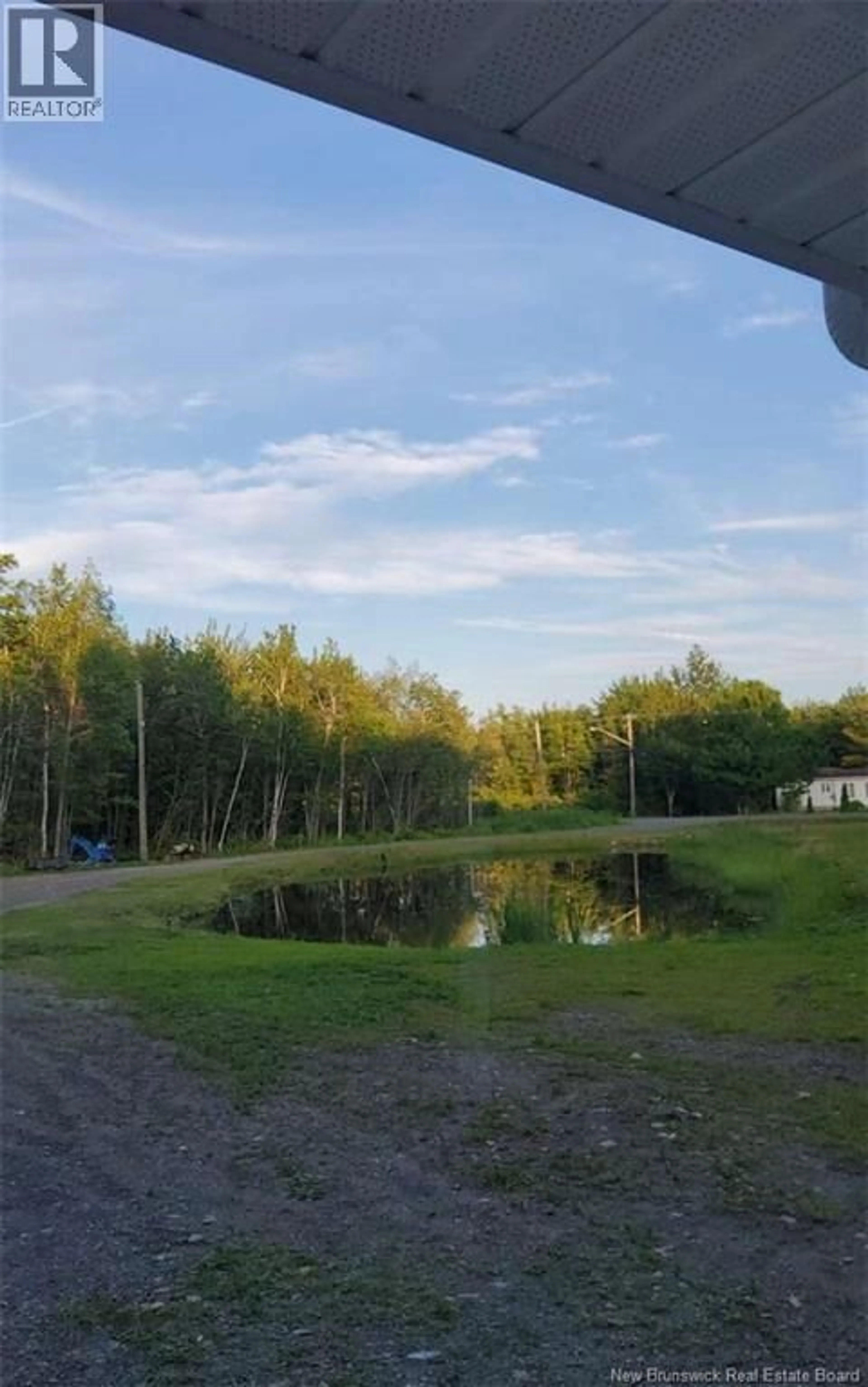 A pic from outside/outdoor area/front of a property/back of a property/a pic from drone, water/lake/river/ocean view for 922 ROBERTVILLE, Robertville New Brunswick E8K2K5