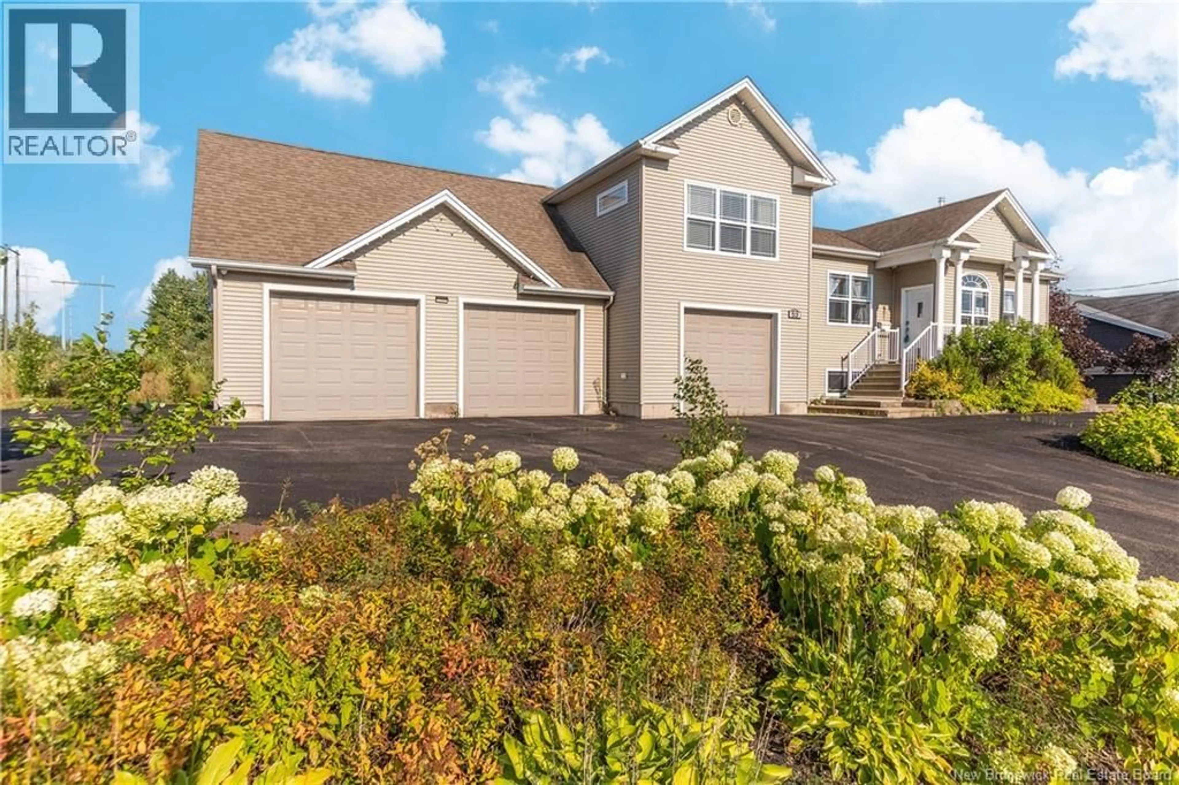 Home with vinyl exterior material, street for 69 WHISPERWOOD DRIVE, Moncton New Brunswick E1G0P7