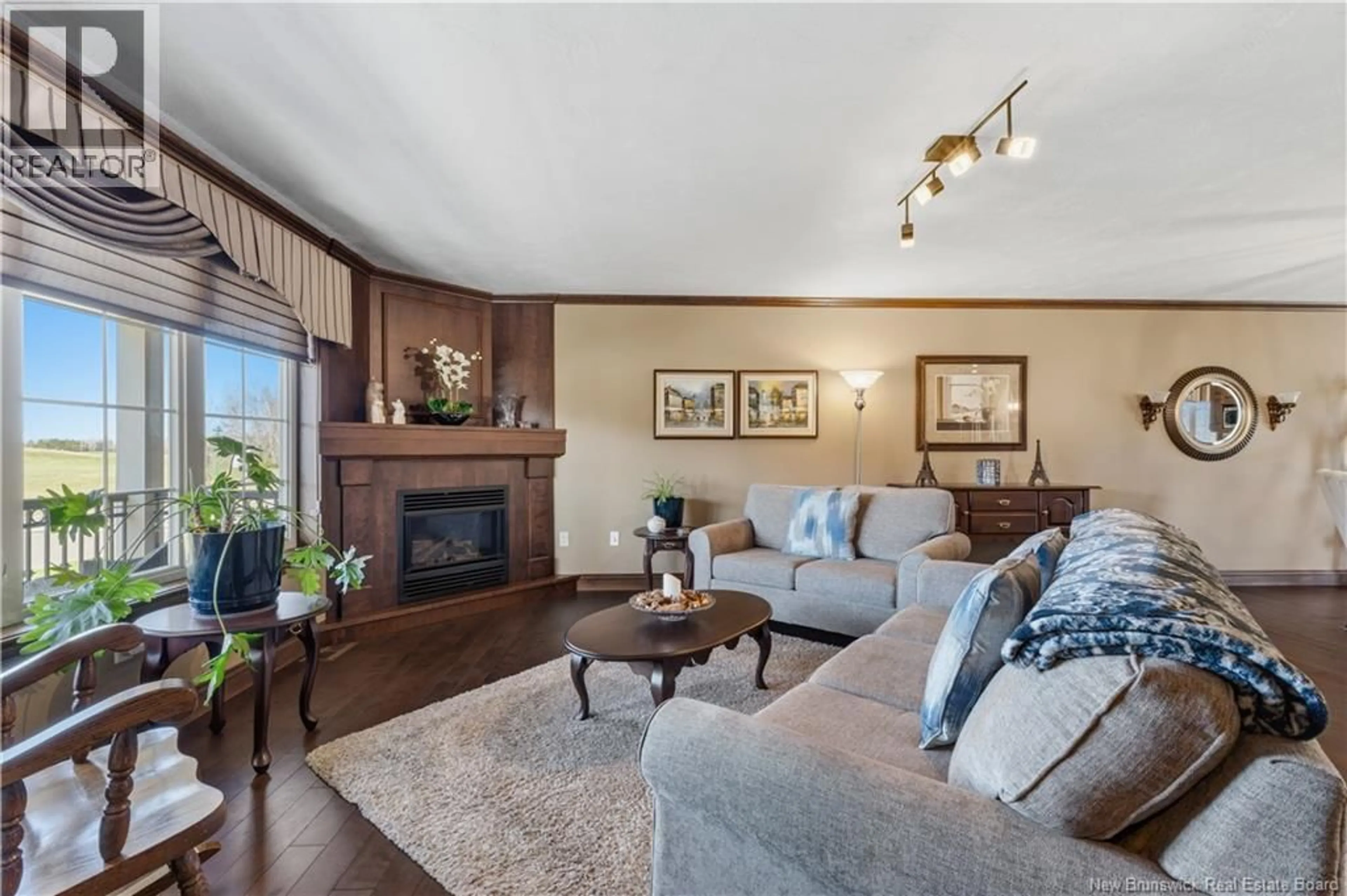 Living room with furniture, wood/laminate floor for 115 ROYAL OAKS BOULEVARD, Irishtown New Brunswick E1H2P7