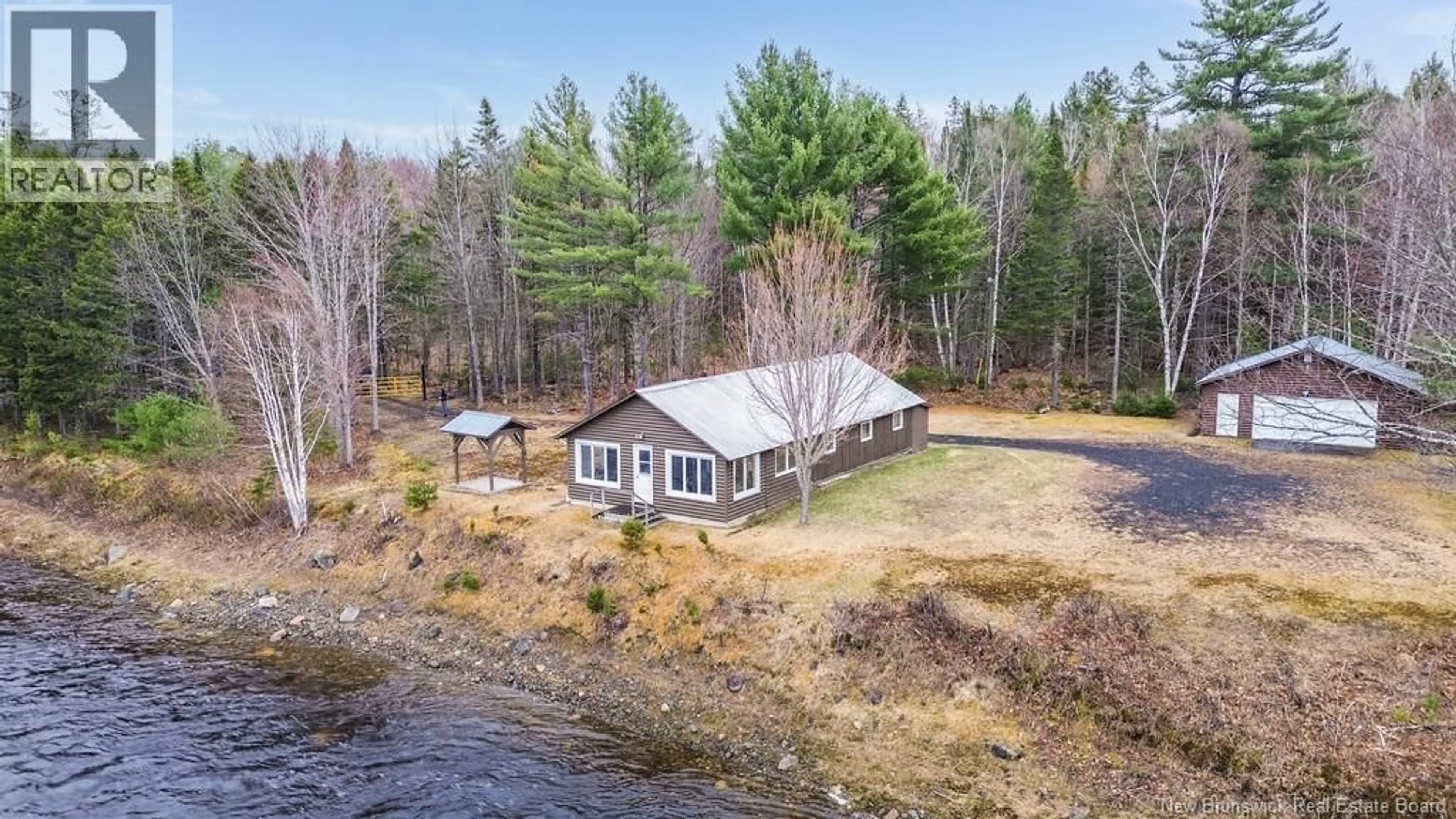 A pic from outside/outdoor area/front of a property/back of a property/a pic from drone, water/lake/river/ocean view for 43 CLARKS POINT ROAD, Boiestown New Brunswick E6A1E7