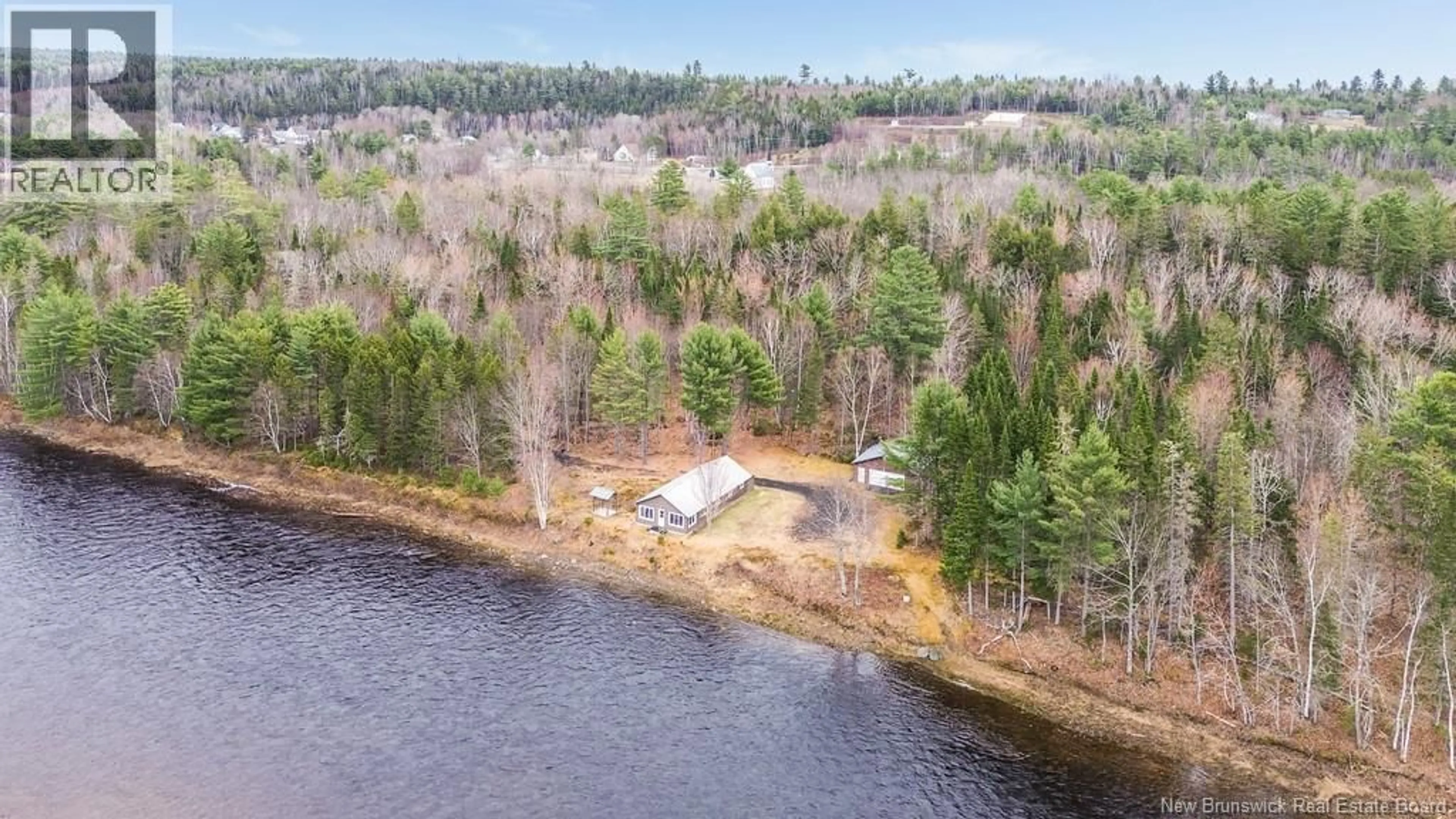 A pic from outside/outdoor area/front of a property/back of a property/a pic from drone, water/lake/river/ocean view for 43 CLARKS POINT ROAD, Boiestown New Brunswick E6A1E7