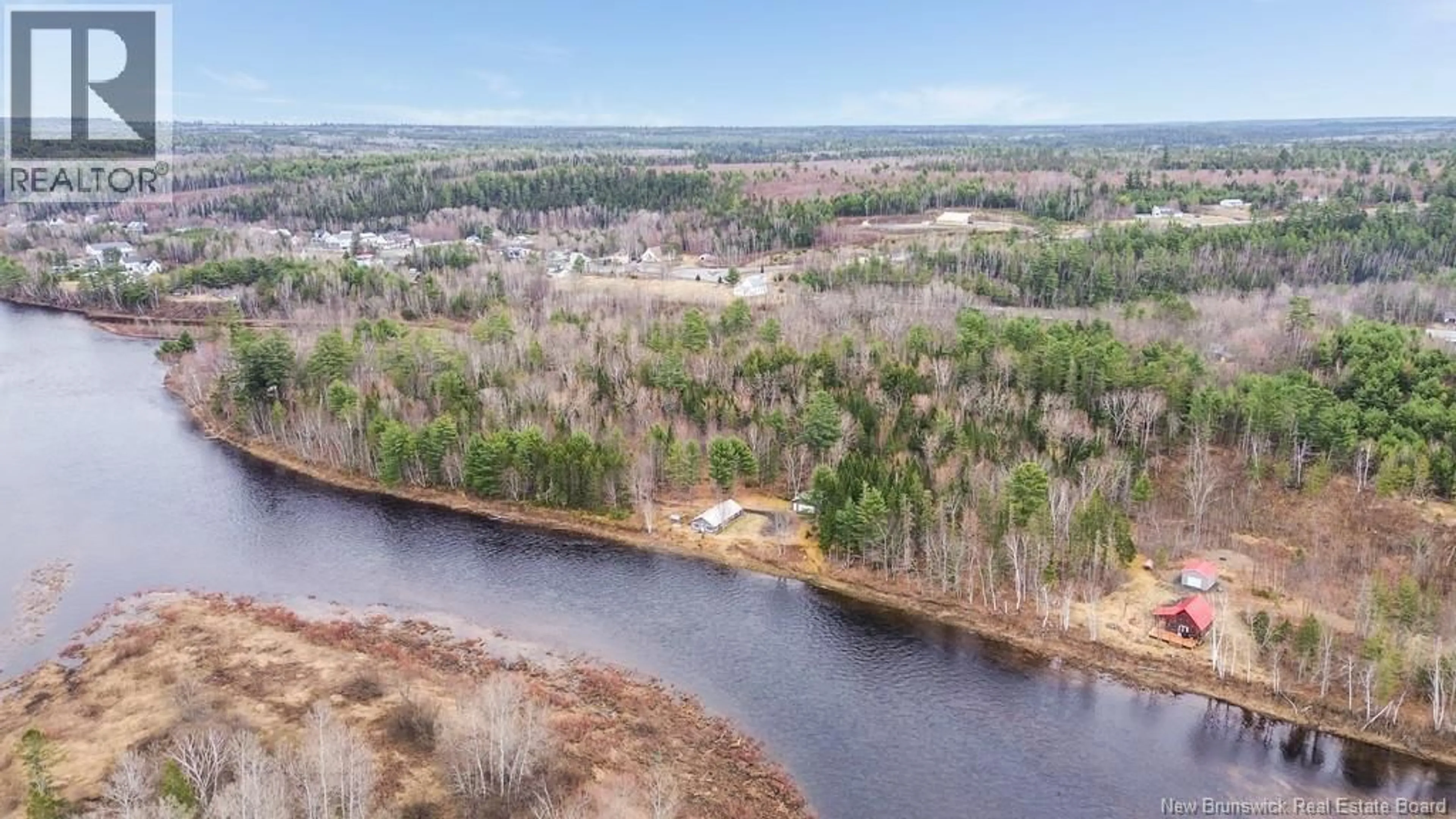 A pic from outside/outdoor area/front of a property/back of a property/a pic from drone, water/lake/river/ocean view for 43 CLARKS POINT ROAD, Boiestown New Brunswick E6A1E7