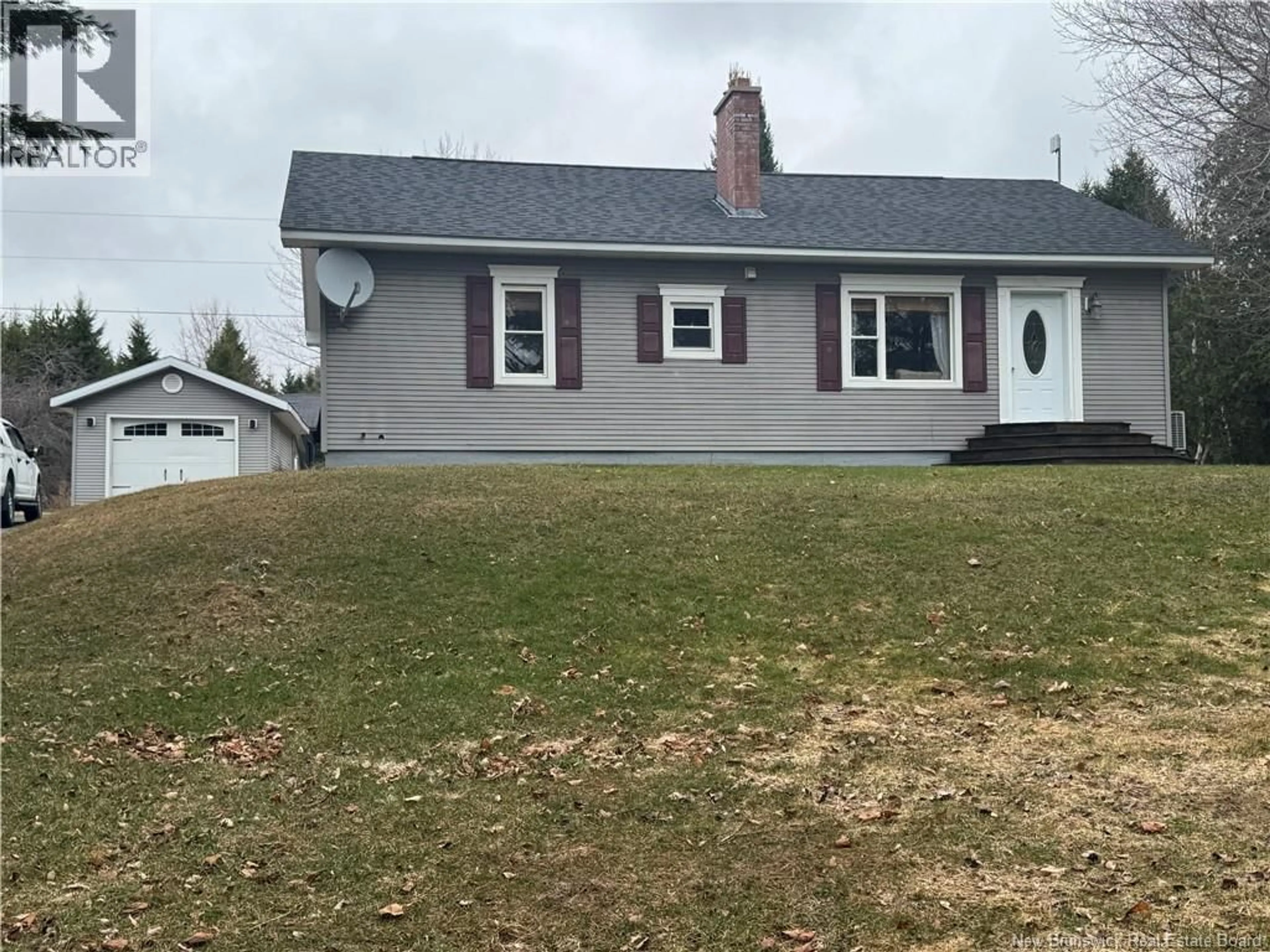 Home with vinyl exterior material, street for 10252 105 ROUTE, Beechwood New Brunswick E7J2A7