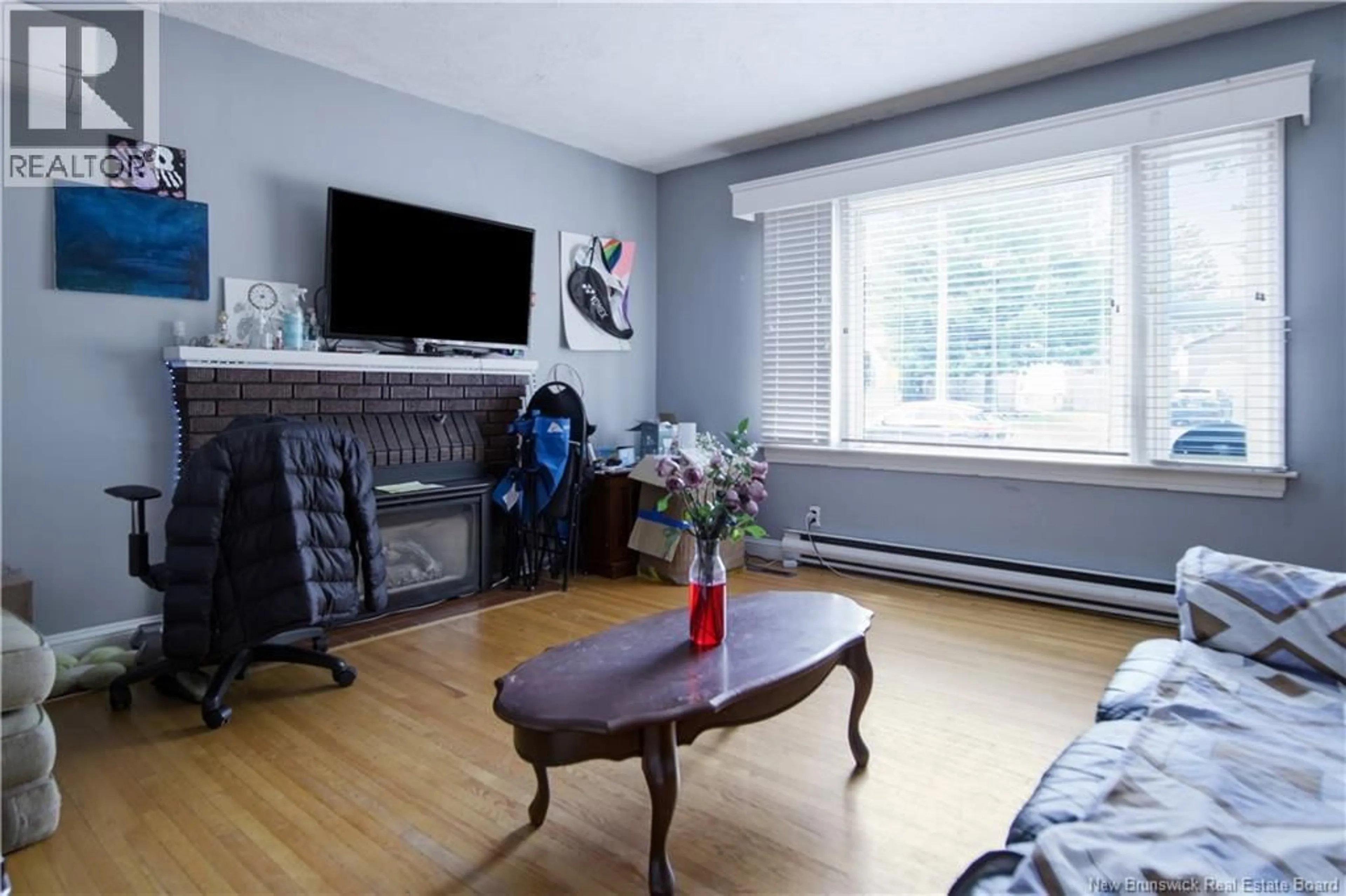 Living room with furniture, wood/laminate floor for 173 MAPLE STREET, Moncton New Brunswick E1C6A5