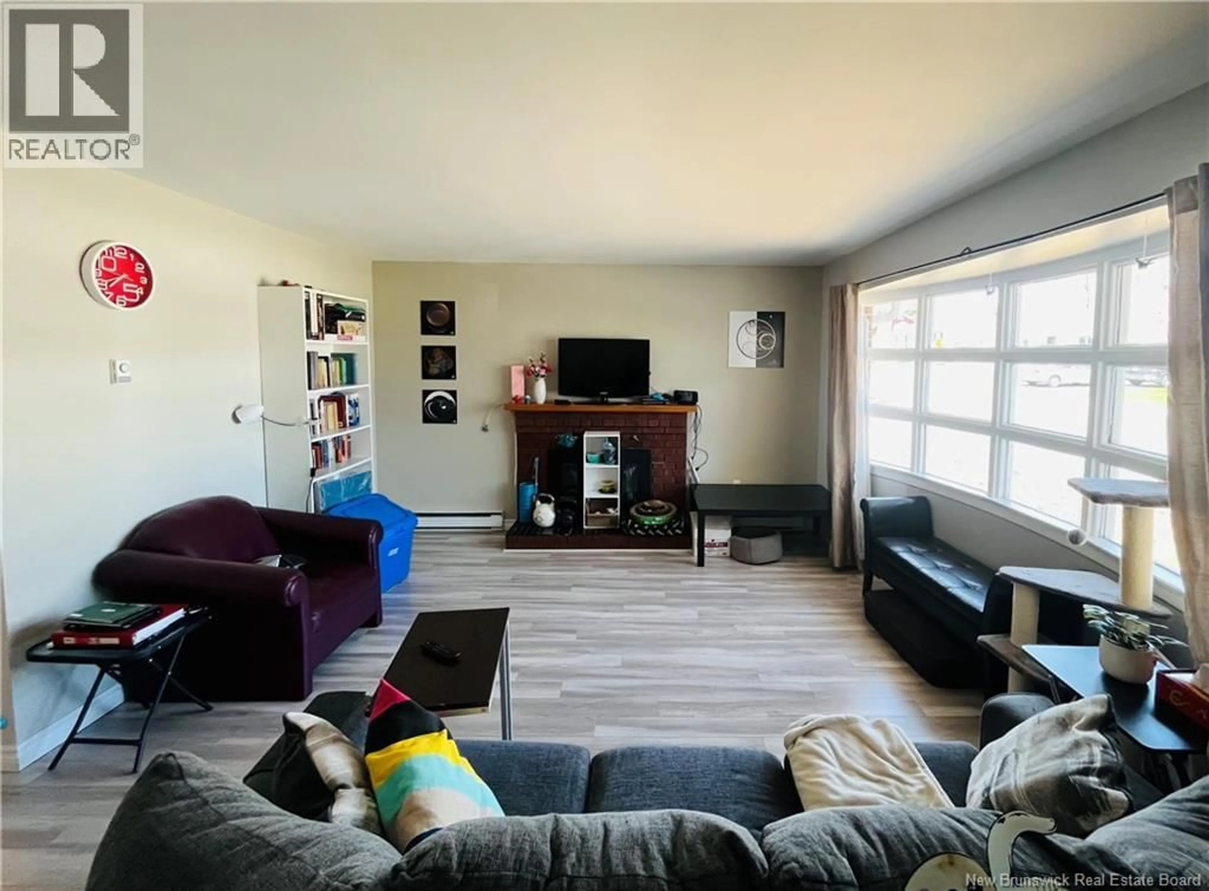 Living room with furniture, wood/laminate floor for 337 FRANCES STREET, Miramichi New Brunswick E1V2V8