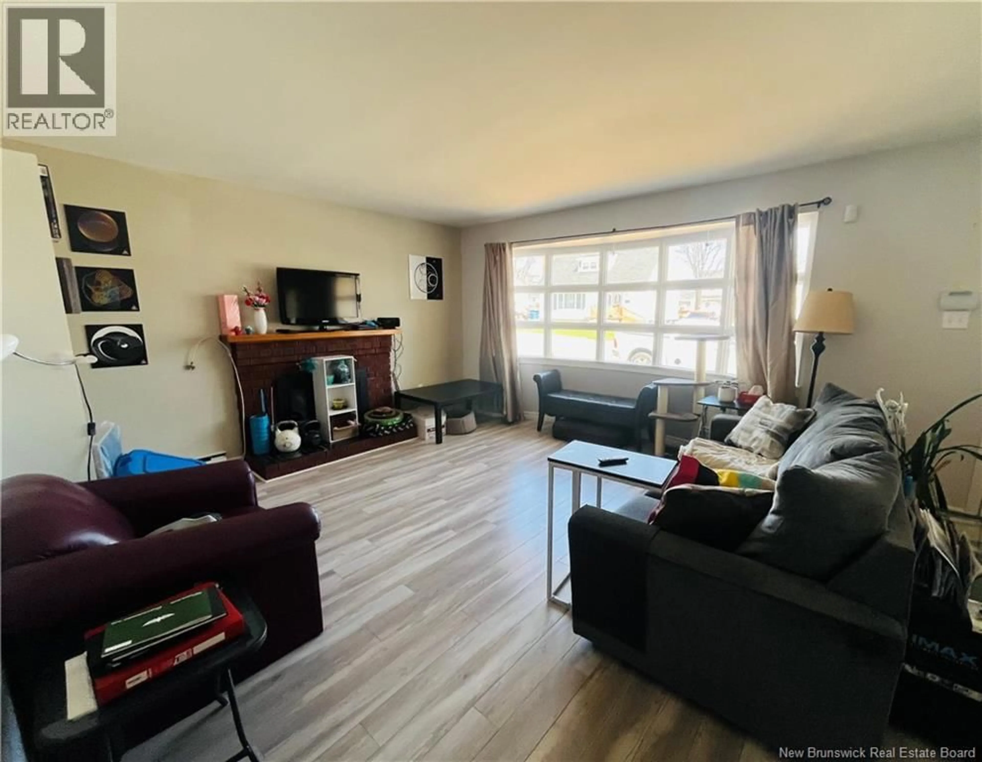 Living room with furniture, wood/laminate floor for 337 FRANCES STREET, Miramichi New Brunswick E1V2V8