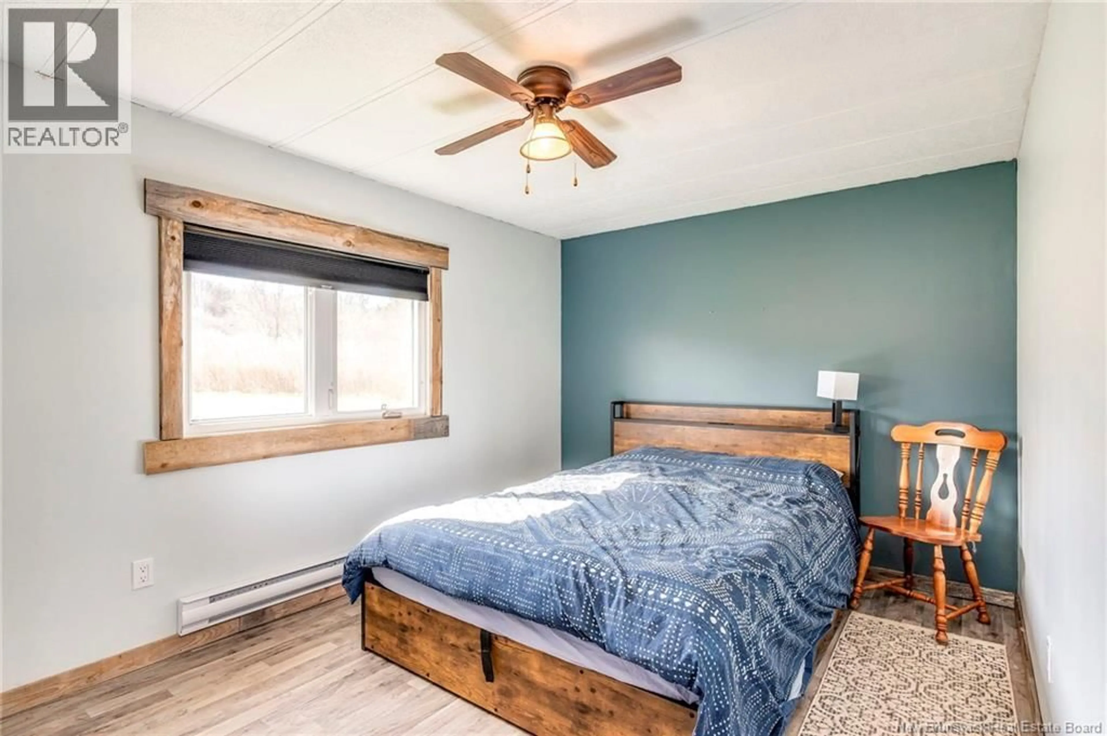 Bedroom with bed, wood/laminate floor for 19 SUNSET AVENUE, Apohaqui New Brunswick E5P3R2