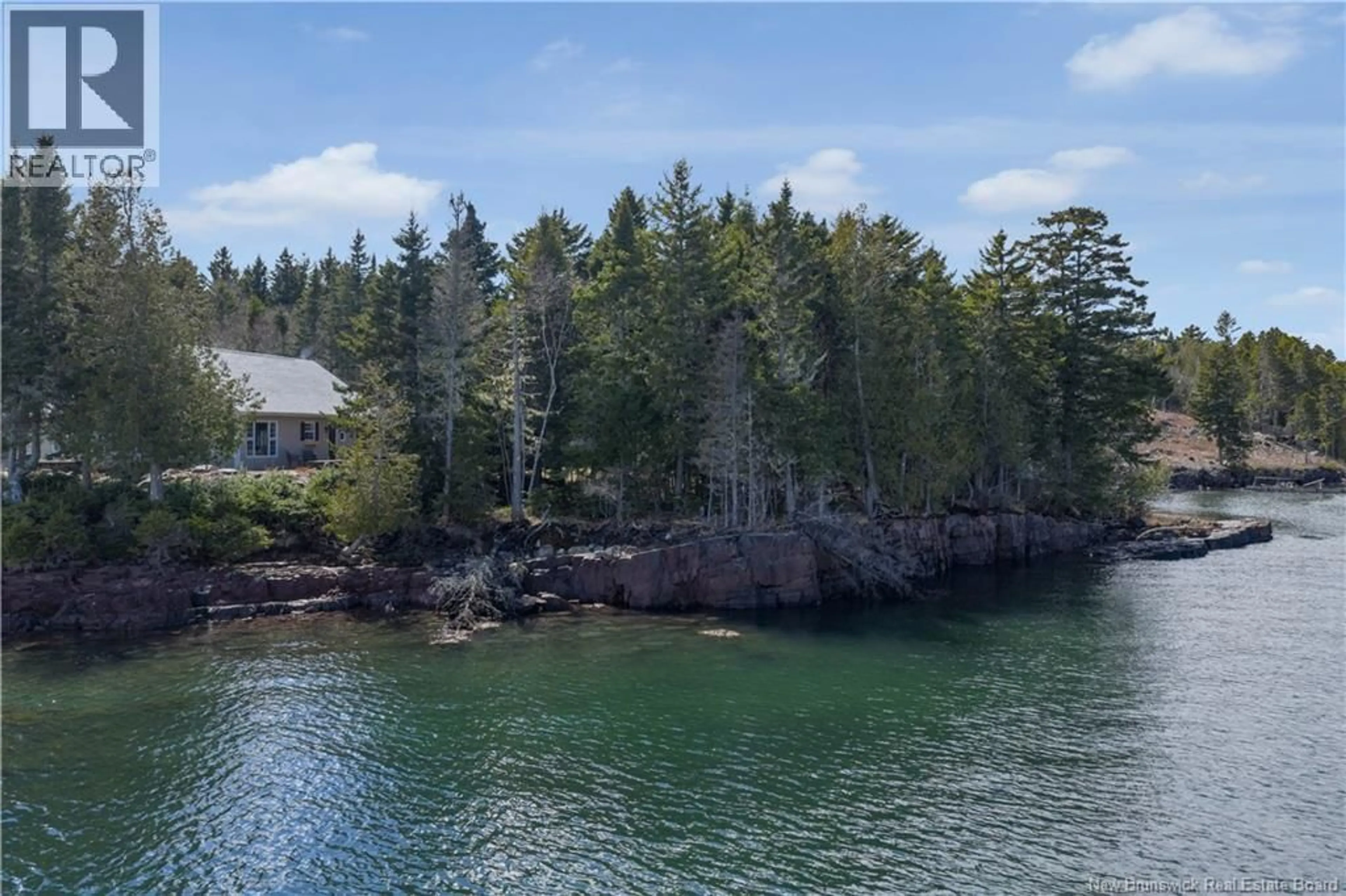 A pic from outside/outdoor area/front of a property/back of a property/a pic from drone, water/lake/river/ocean view for 31 BIRCH COVE ROAD, Chamcook New Brunswick E5B3E1