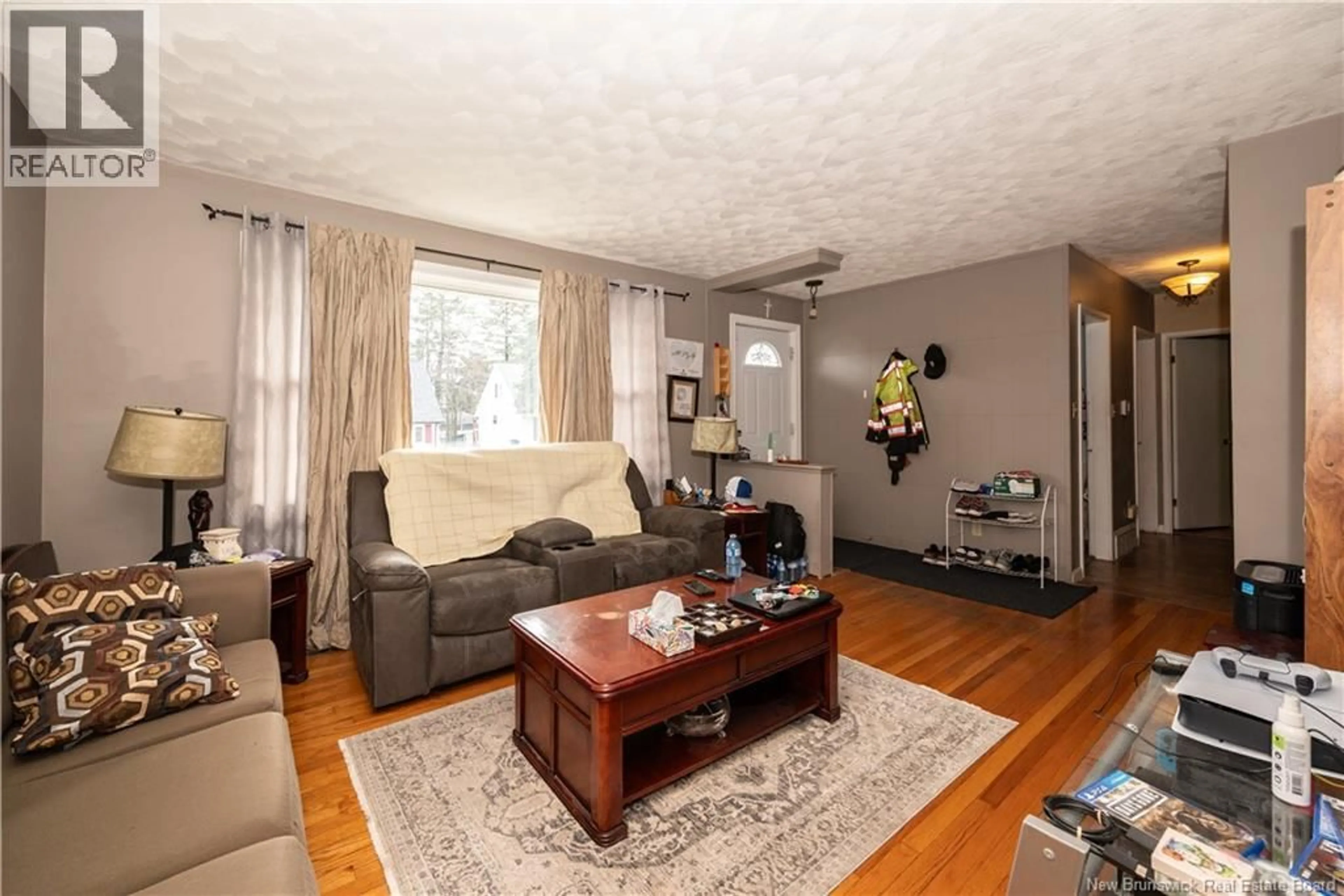 Living room with furniture, wood/laminate floor for 190 MAPLE STREET, Moncton New Brunswick E1C6A4