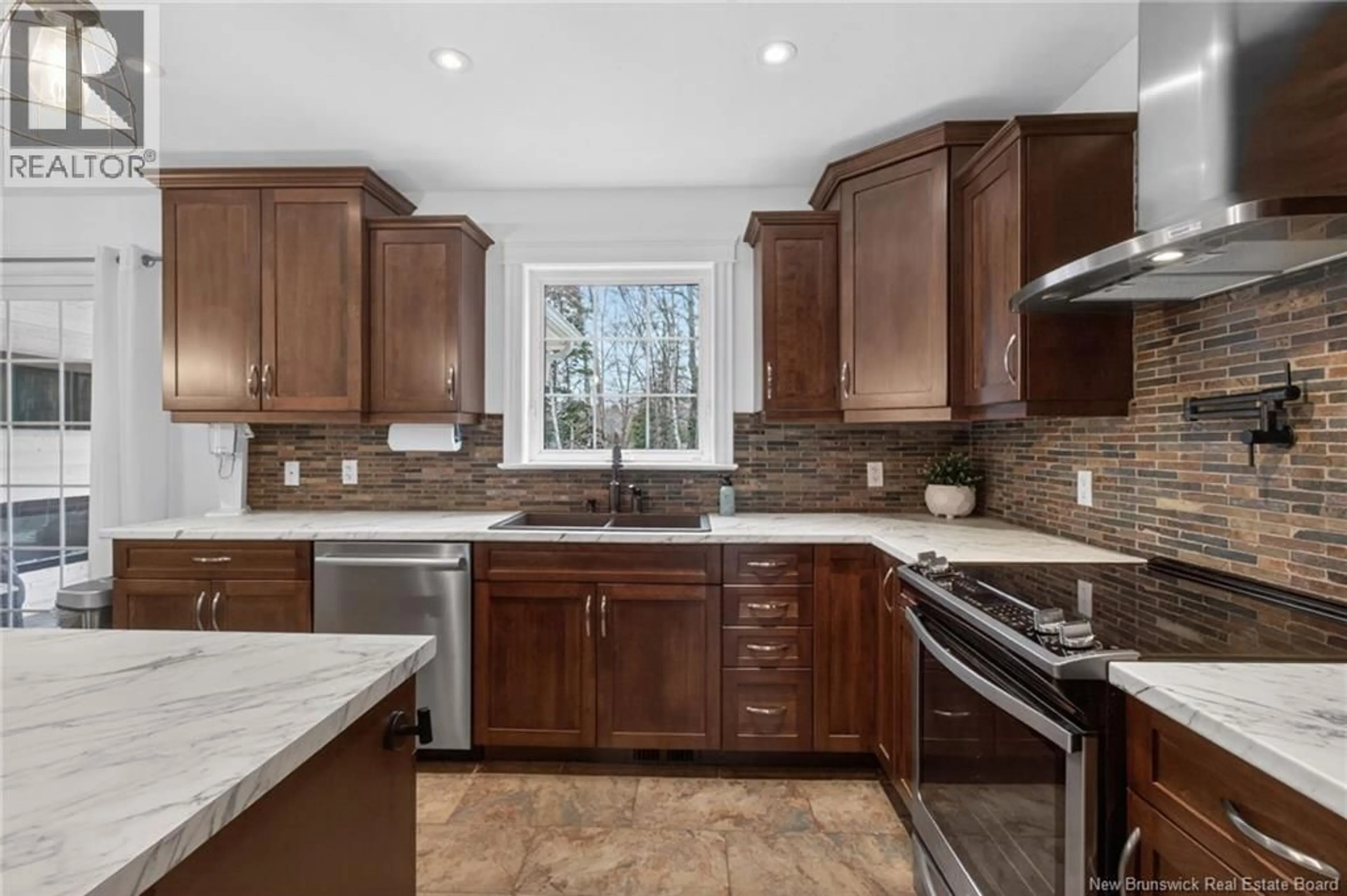 Open concept kitchen, ceramic/tile floor for 23 BRIAN DRIVE, Saint-Antoine New Brunswick E4V3L6