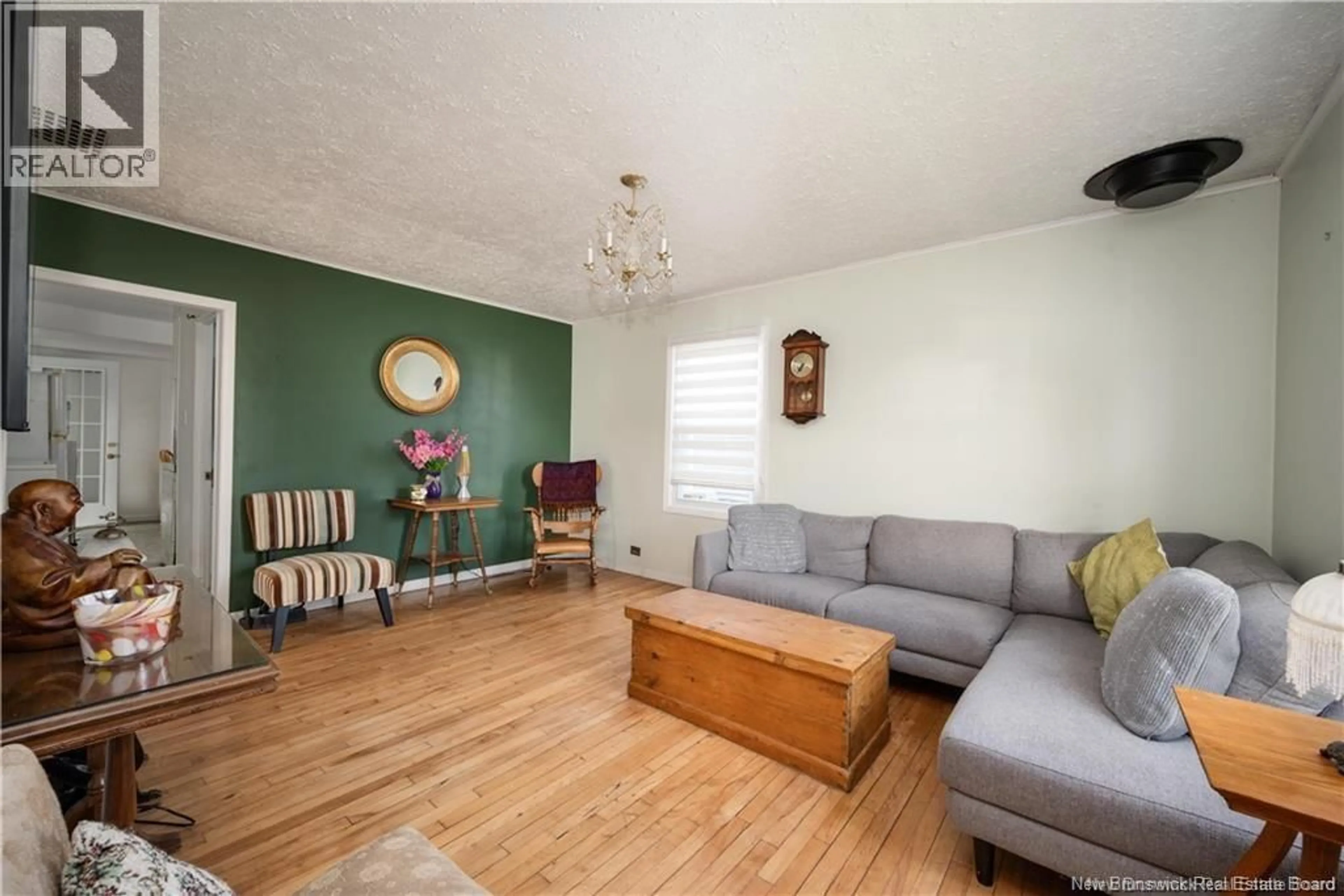 Living room with furniture, wood/laminate floor for 29 COPP STREET, Dieppe New Brunswick E1A2G9