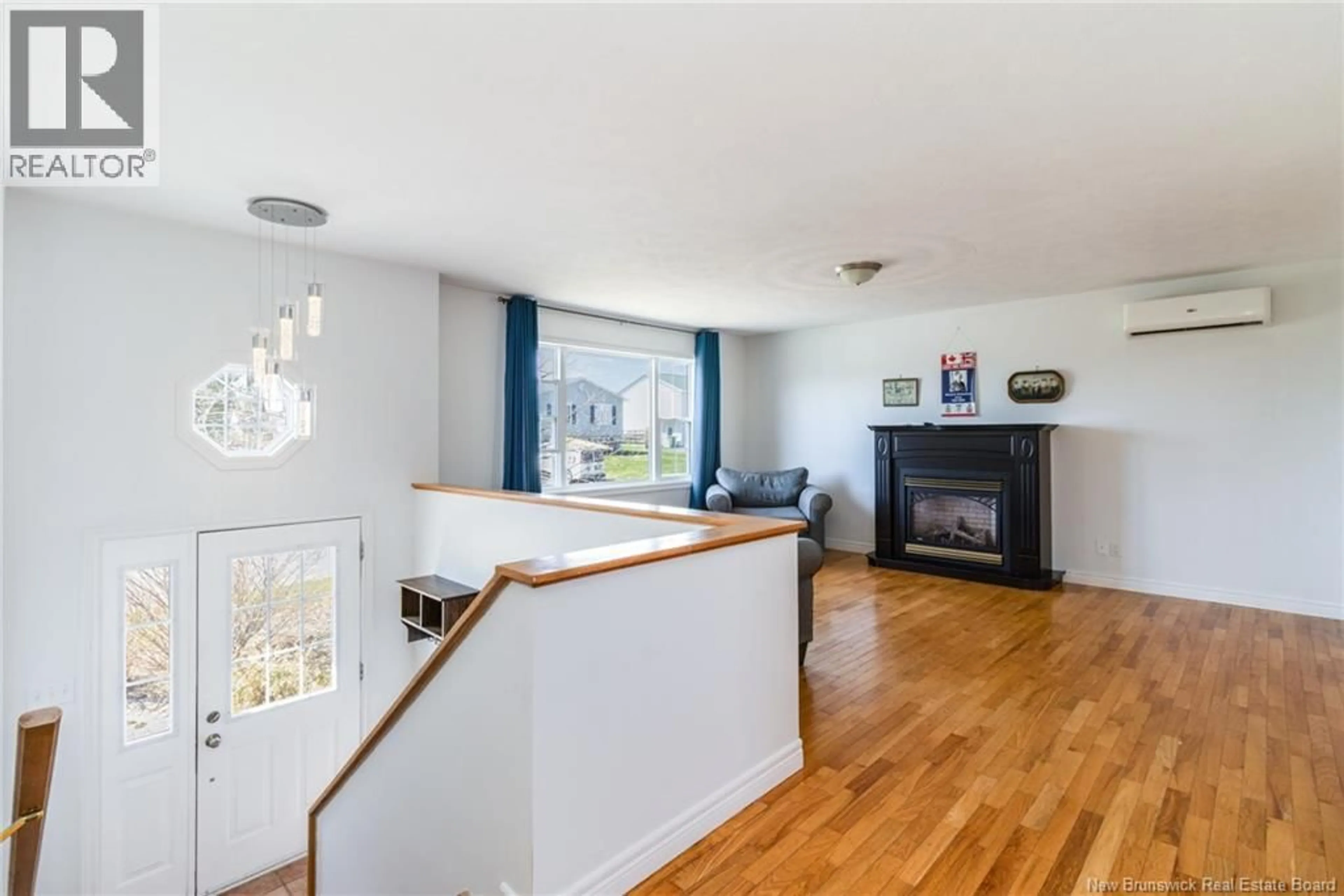 Living room with furniture, wood/laminate floor for 80 DUFFIE DRIVE, Oromocto New Brunswick E2V4L3