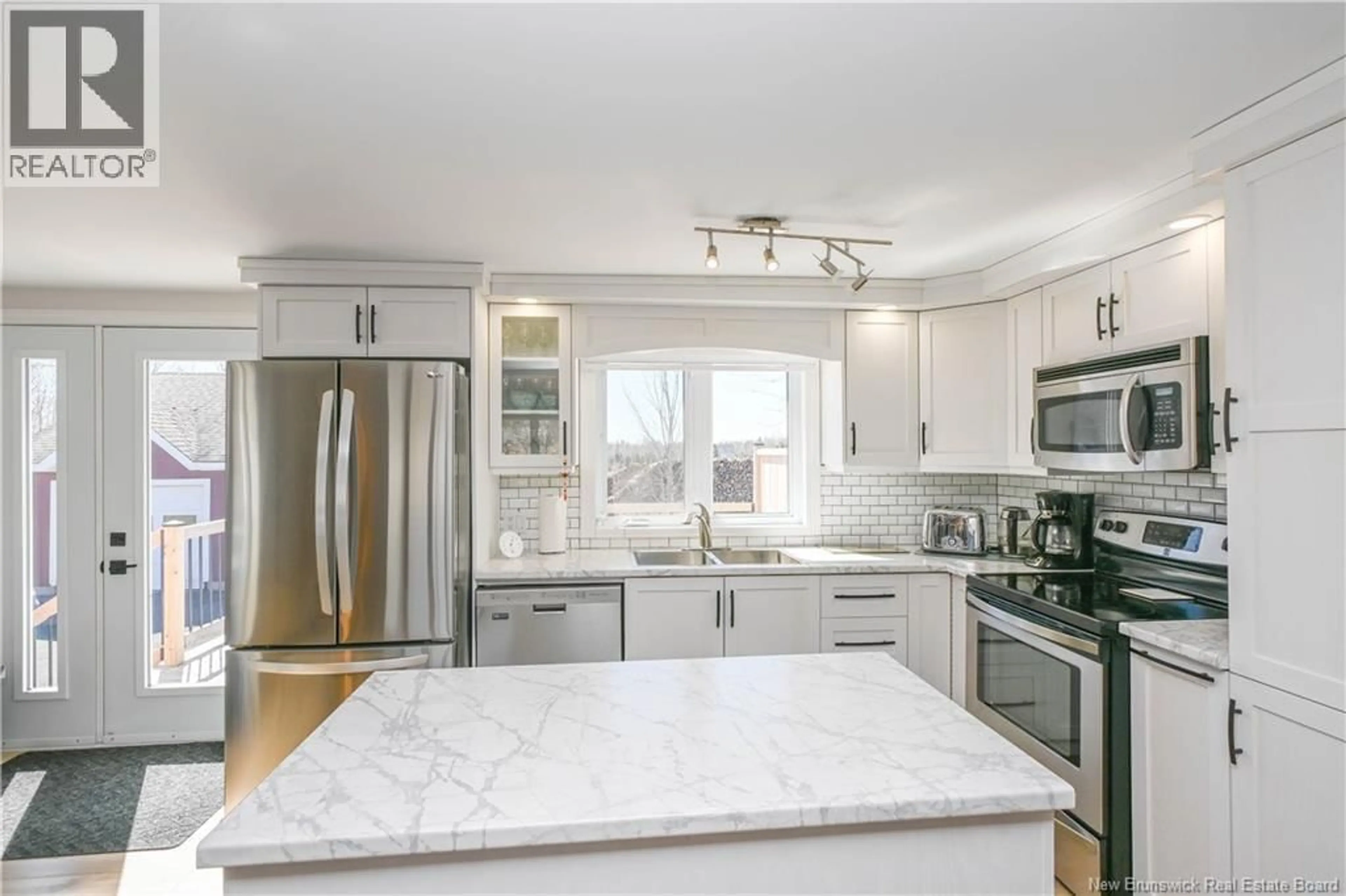 Open concept kitchen, ceramic/tile floor for 1358 DES FONDATEURS STREET, Paquetville New Brunswick E8R1A4