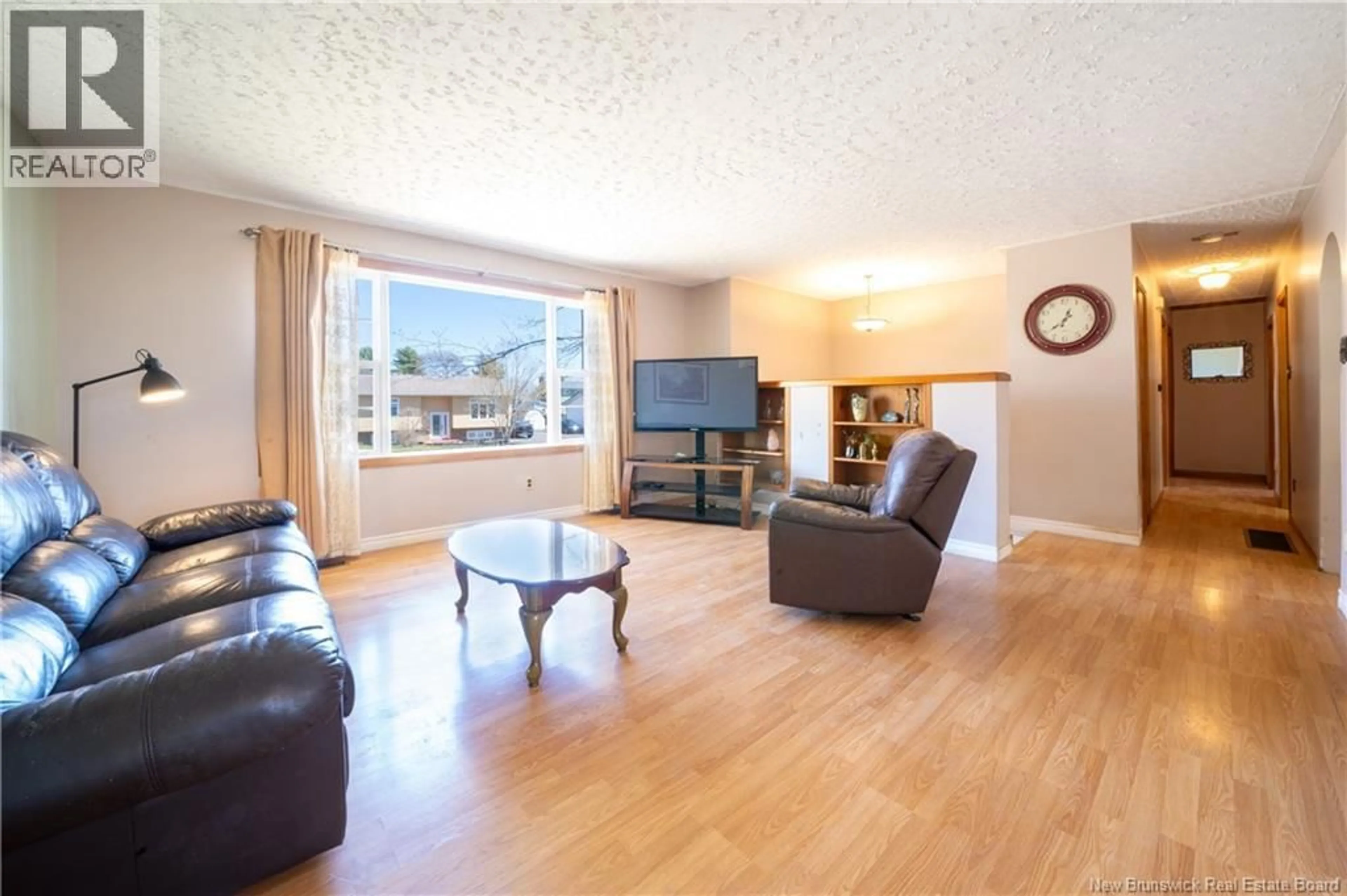 Living room with furniture, wood/laminate floor for 52 DEEPWOOD STREET, Moncton New Brunswick E1A4Z3