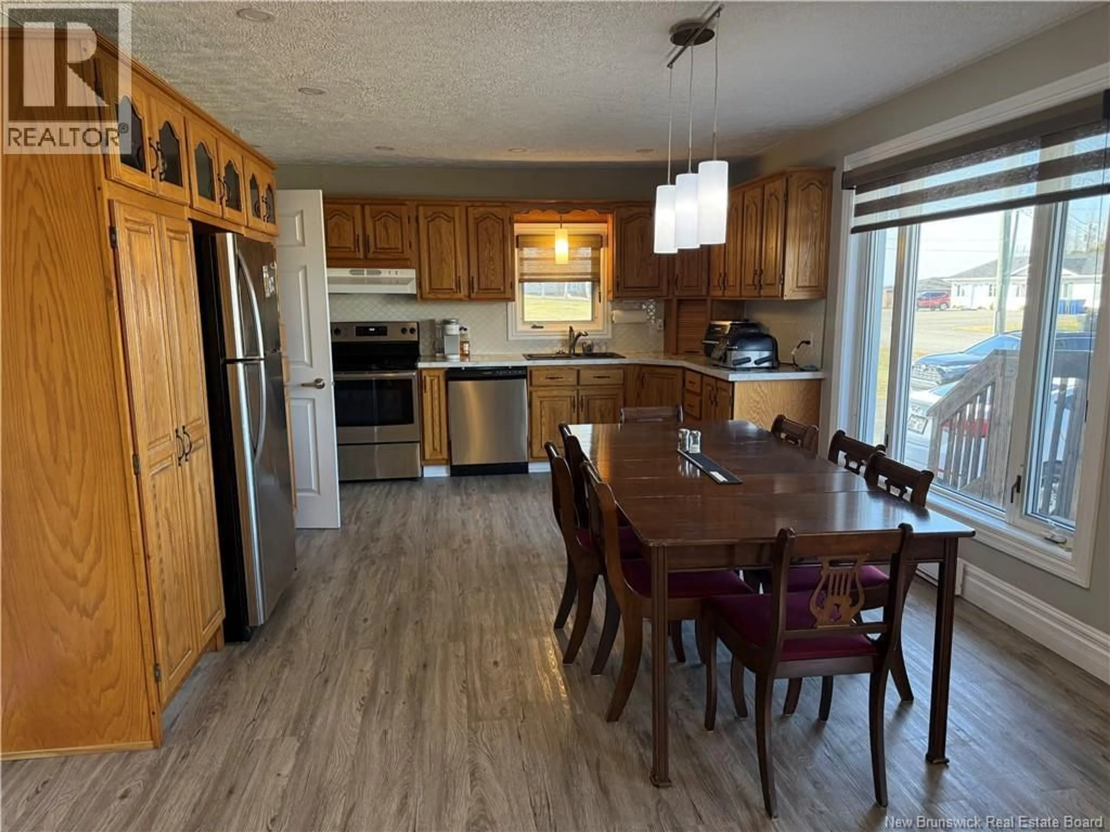 Open concept kitchen, wood/laminate floor for 104 MATHIEU STREET, Drummond New Brunswick E3Y3W7