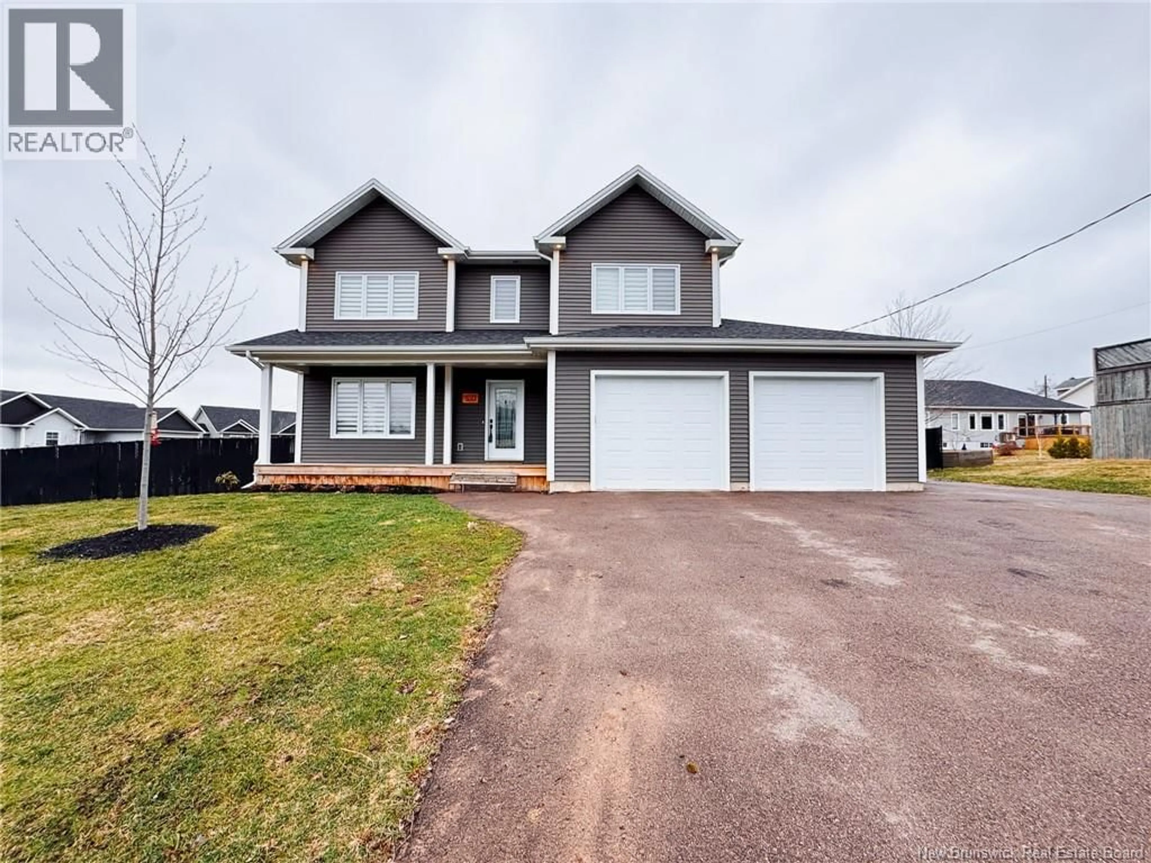 Home with vinyl exterior material, street for 50 DOIRON, Dieppe New Brunswick E1A0X8