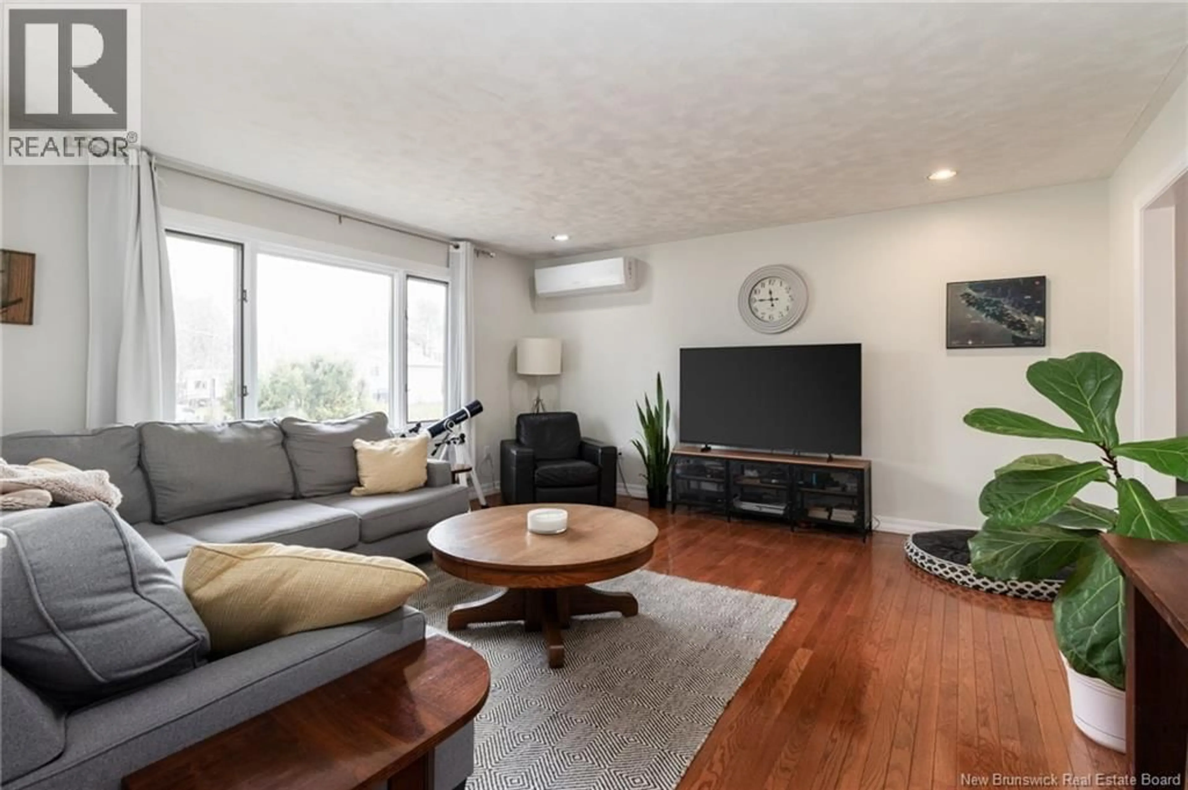 Living room with furniture, wood/laminate floor for 161 PHILLIPS DRIVE, New Maryland New Brunswick E3C1E8
