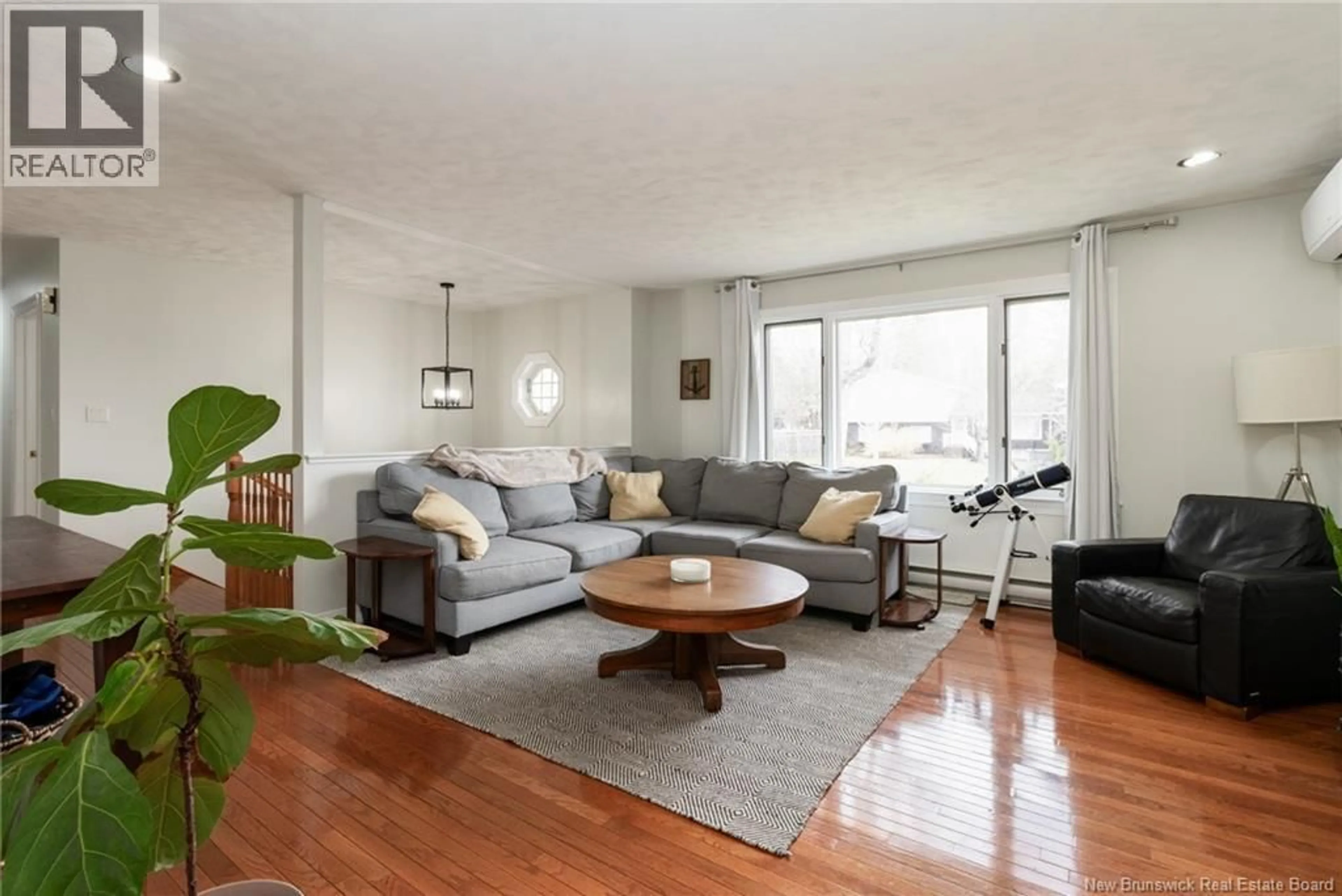 Living room with furniture, wood/laminate floor for 161 PHILLIPS DRIVE, New Maryland New Brunswick E3C1E8