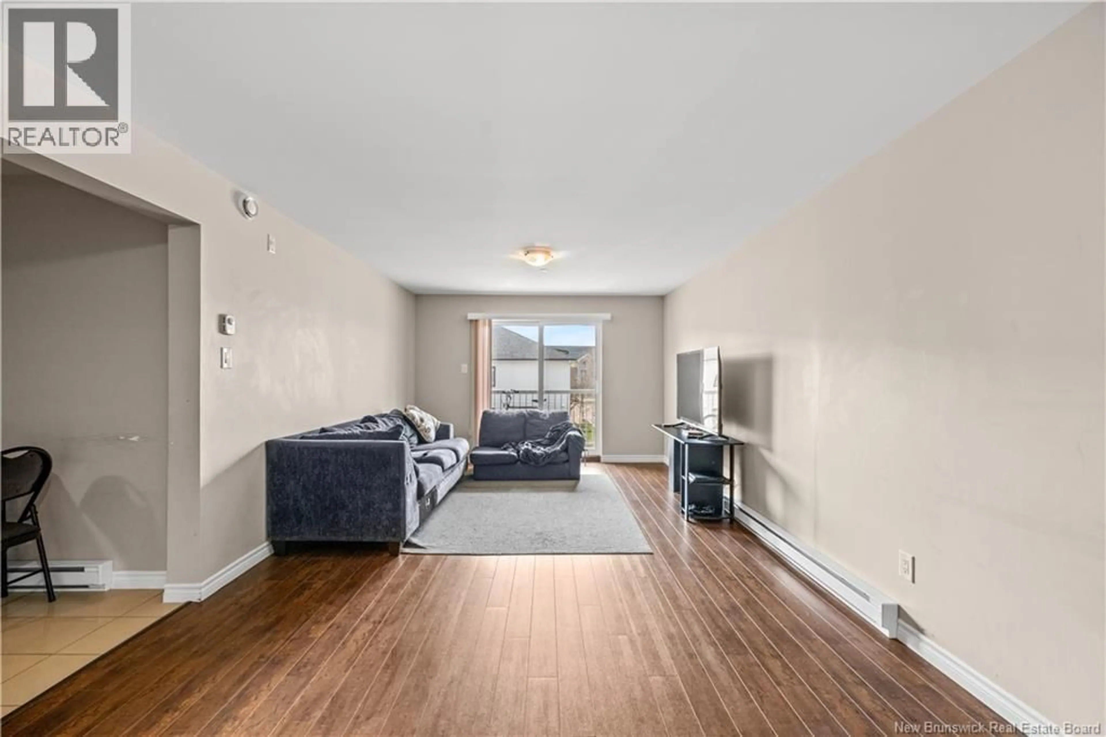 Living room with furniture, unknown for 206 - 33 SIFROI STREET, Dieppe New Brunswick E1A1L6