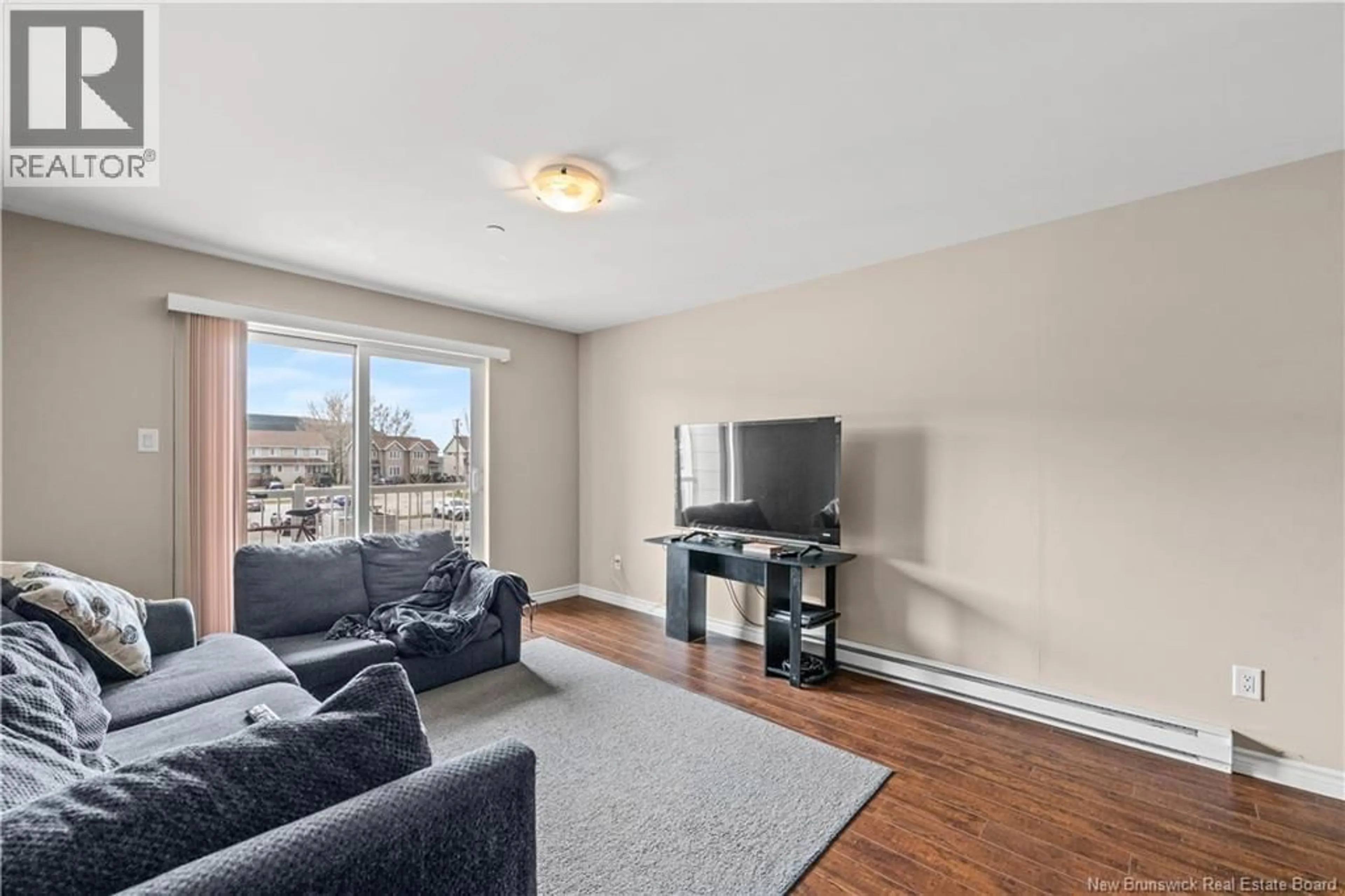 Living room with furniture, unknown for 206 - 33 SIFROI STREET, Dieppe New Brunswick E1A1L6