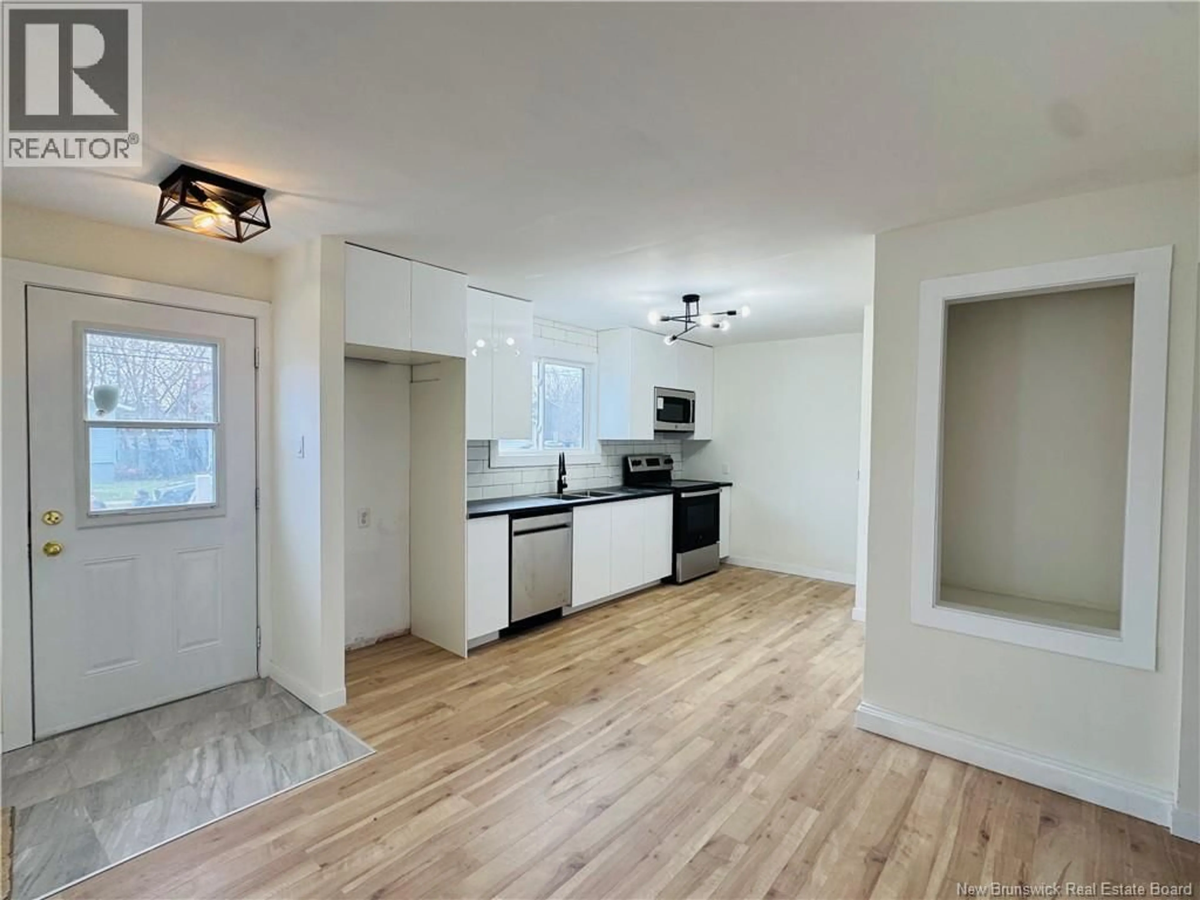 Open concept kitchen, wood/laminate floor for 34 ATKINSON AVENUE, Moncton New Brunswick E1C7S3