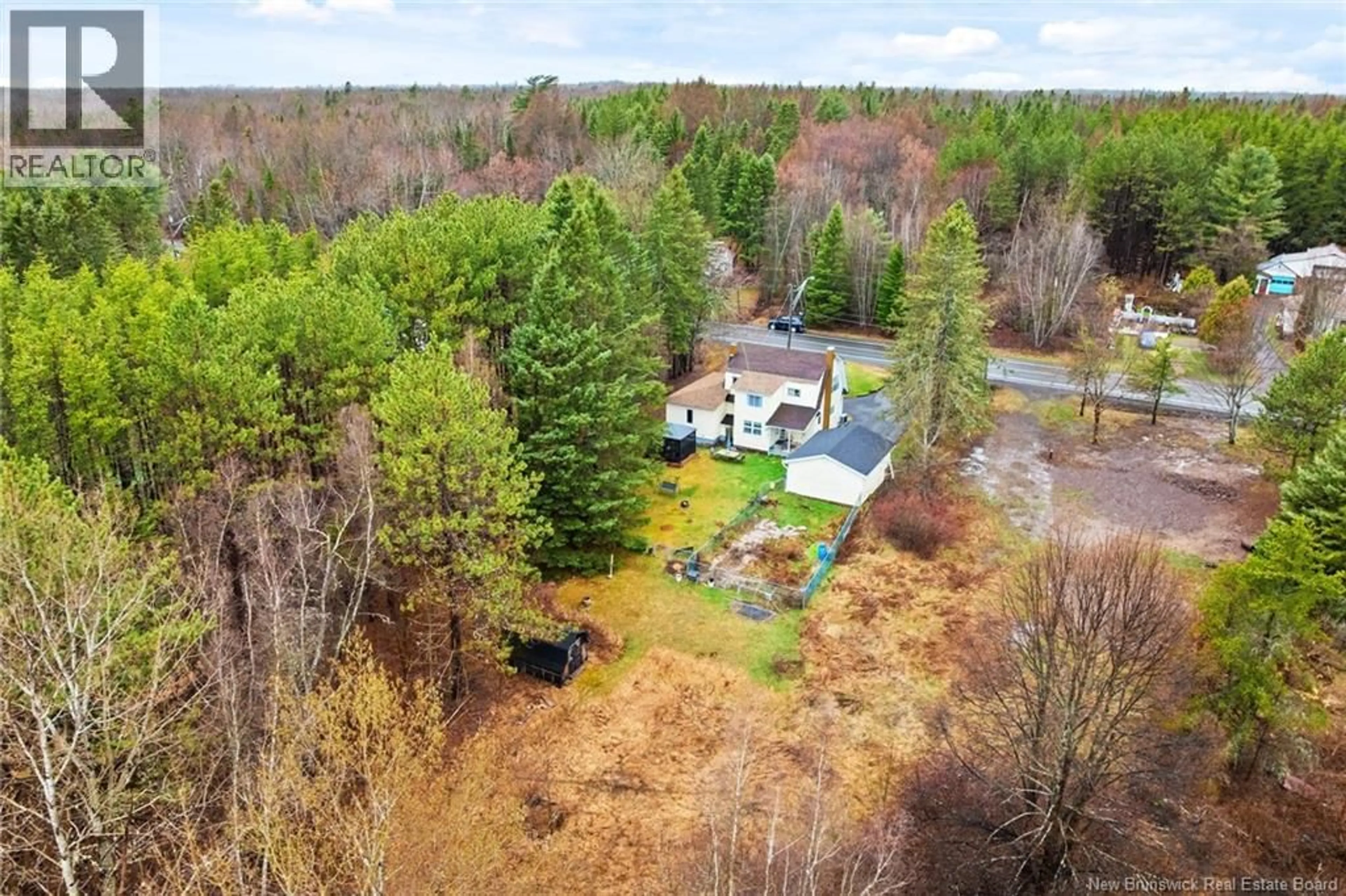 A pic from outside/outdoor area/front of a property/back of a property/a pic from drone, forest/trees view for 56 LILLOETT DRIVE, Chipman New Brunswick E4A1V7