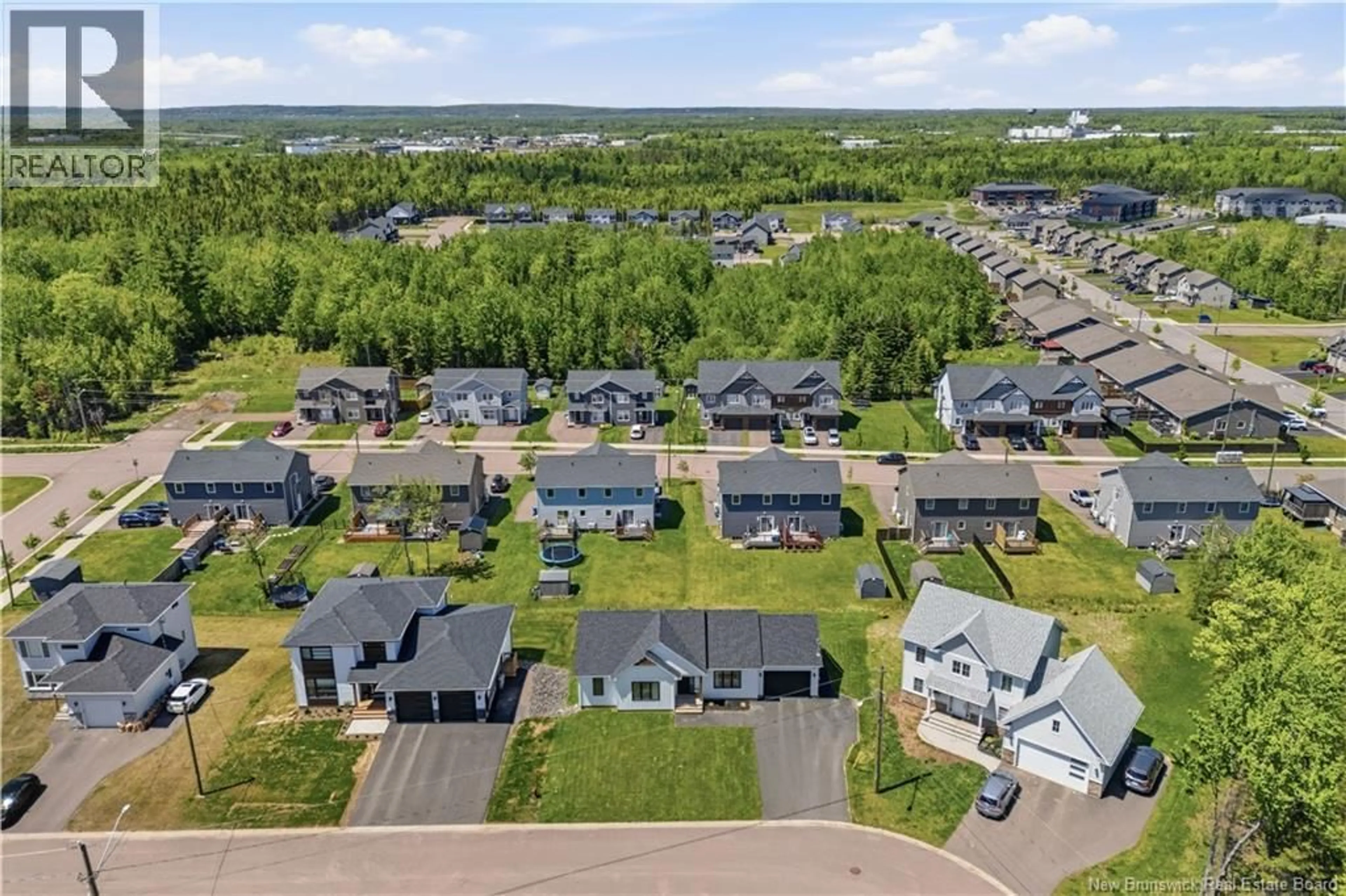 A pic from outside/outdoor area/front of a property/back of a property/a pic from drone, mountain view for 19 LE GUERNE COURT, Moncton New Brunswick E1K0A3