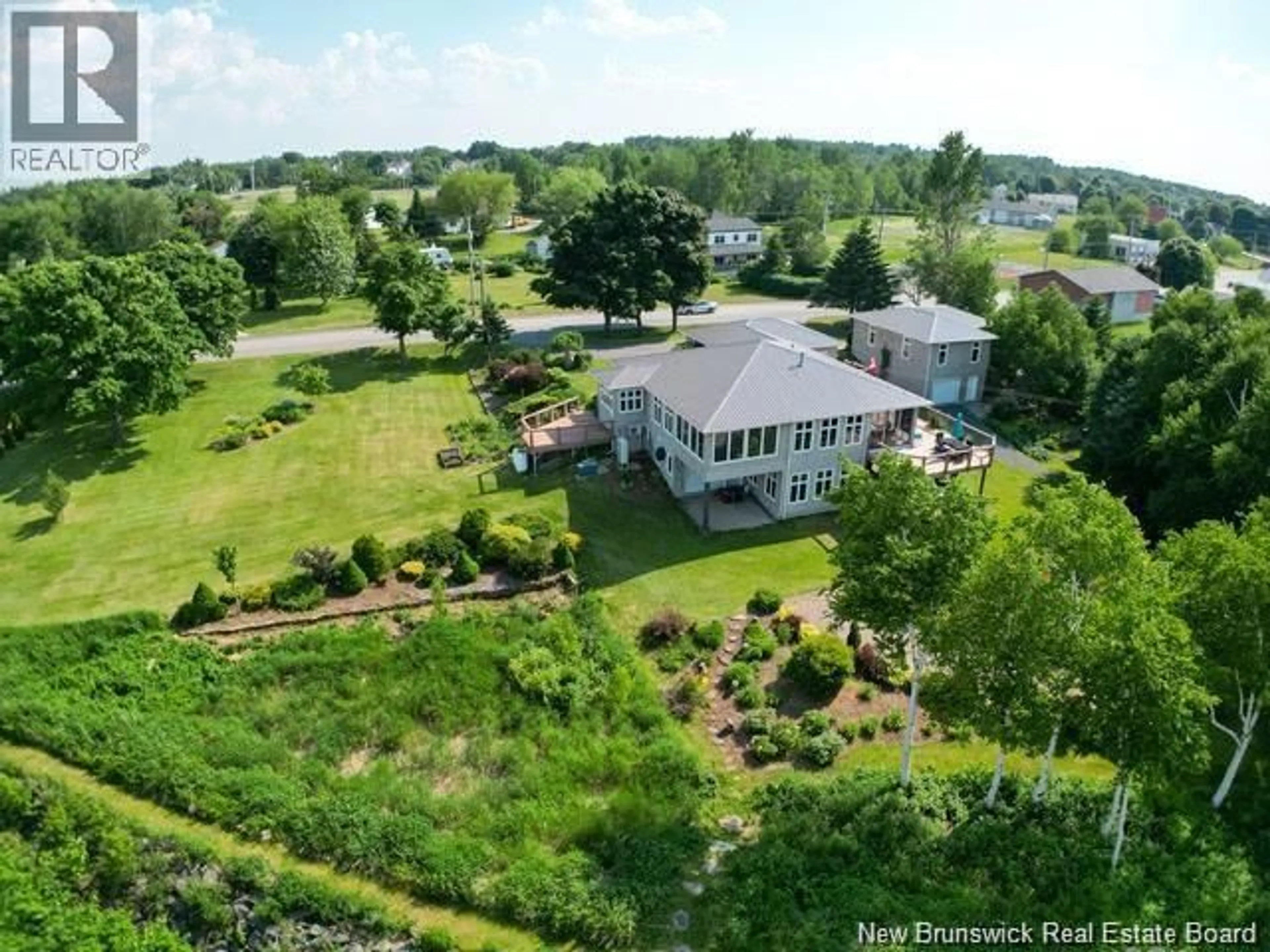A pic from outside/outdoor area/front of a property/back of a property/a pic from drone, water/lake/river/ocean view for 4361 WATER STREET, Miramichi New Brunswick E1N4M1