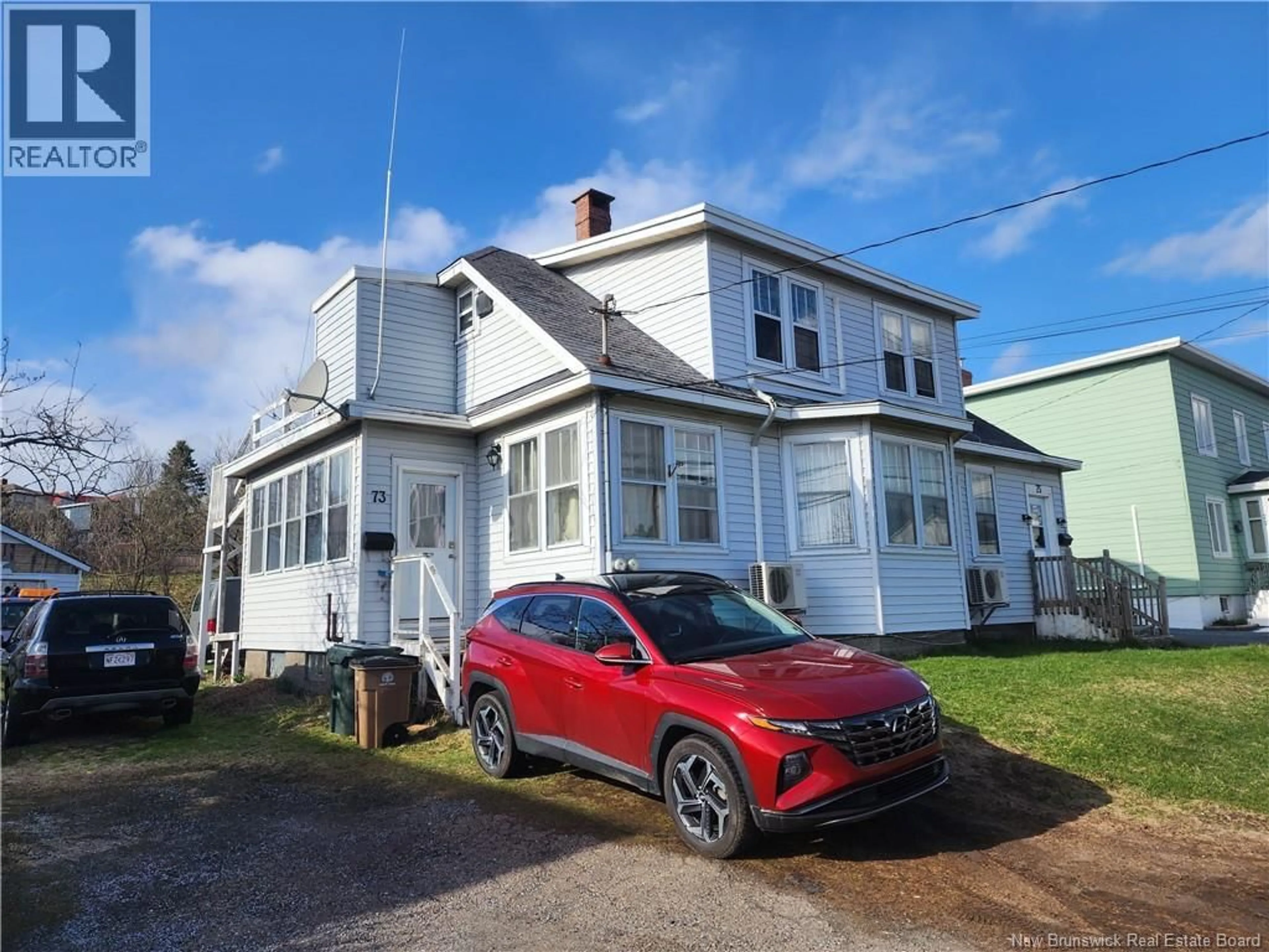 A pic from outside/outdoor area/front of a property/back of a property/a pic from drone, street for 73-75 LOCH LOMOND, Saint John New Brunswick E2J1X6
