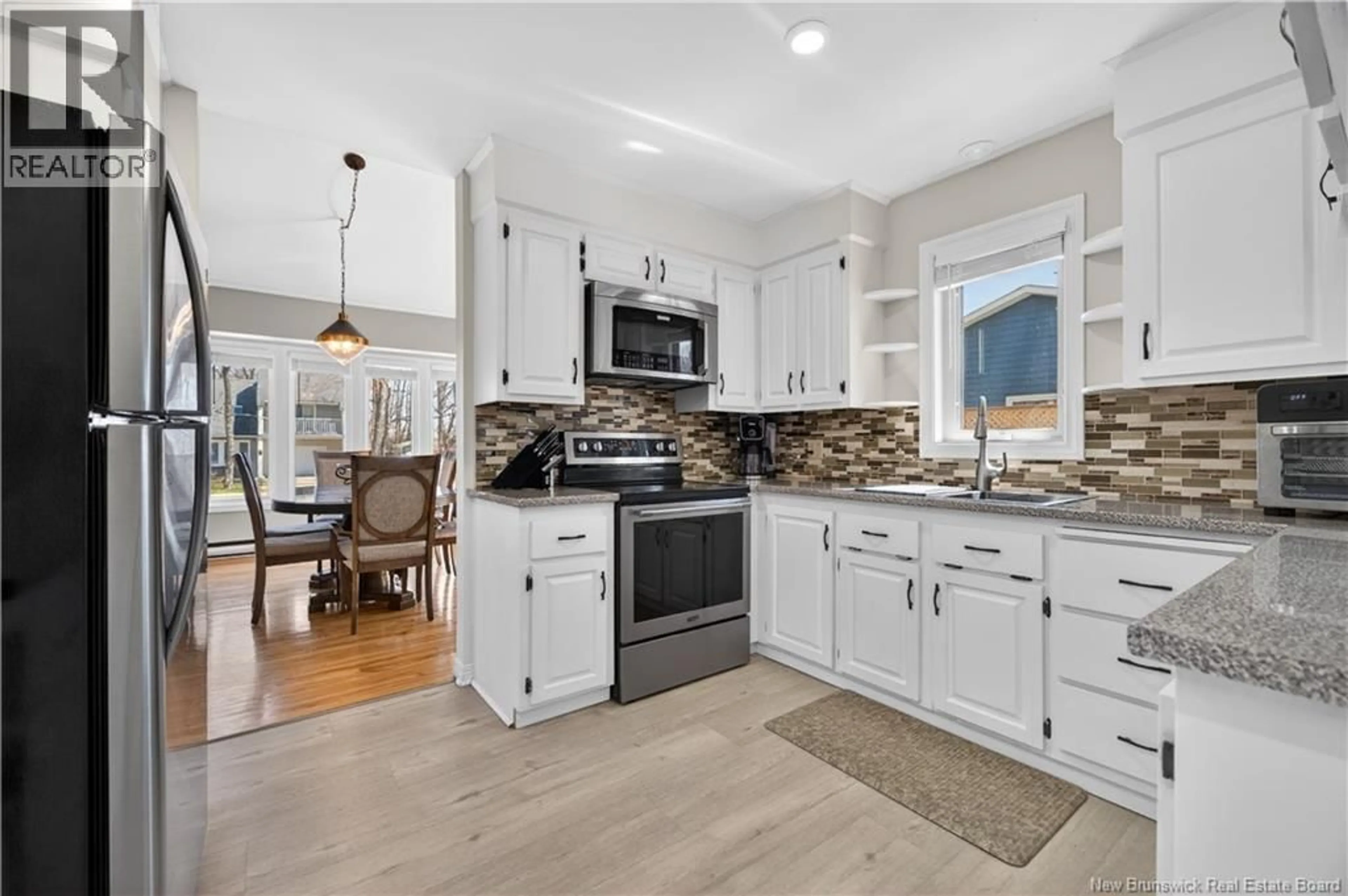 Open concept kitchen, ceramic/tile floor for 14 REDWOOD DRIVE, Moncton New Brunswick E1G1V6