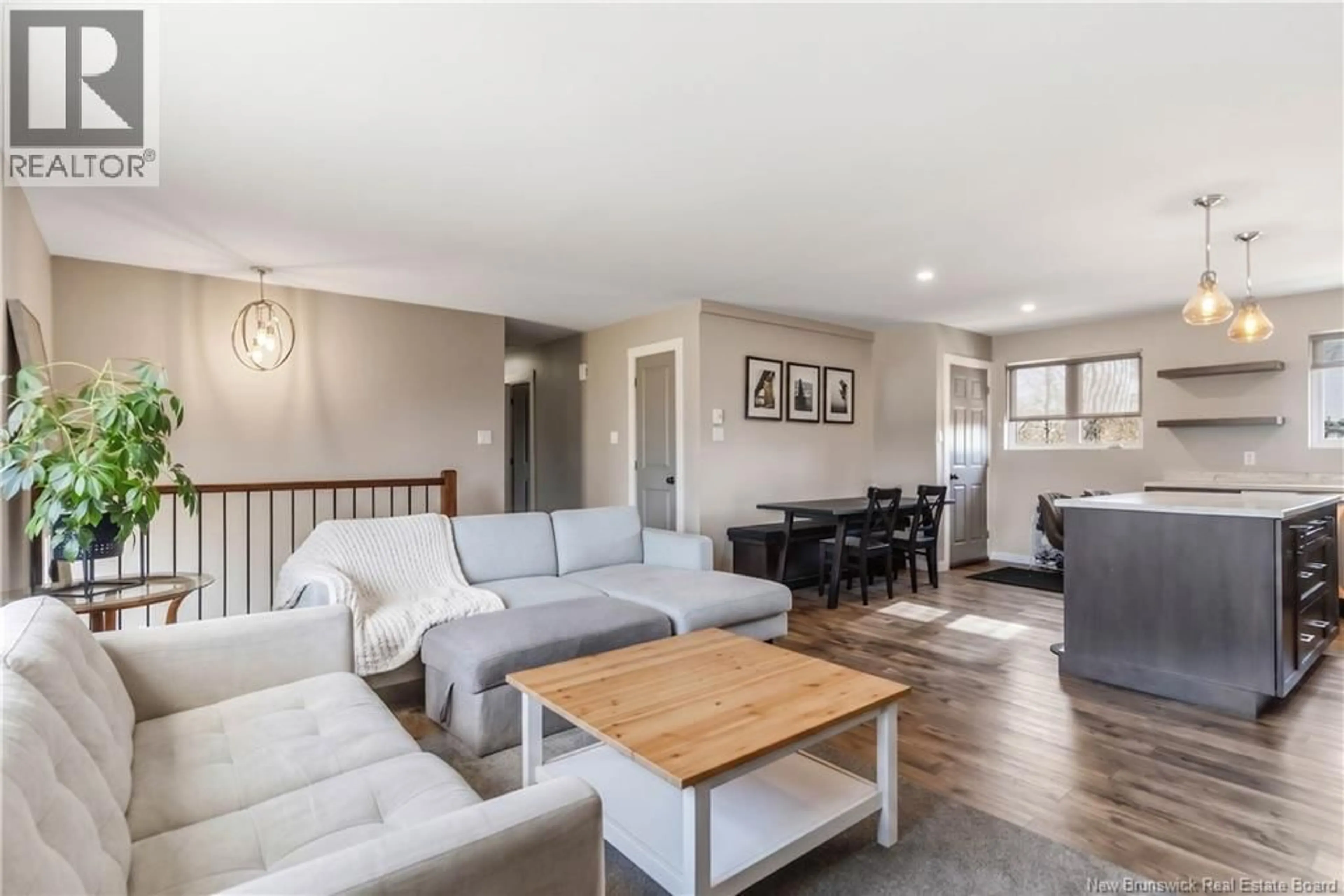 Living room with furniture, wood/laminate floor for 141-145 MCKAY AVENUE, Moncton New Brunswick E1A3A2
