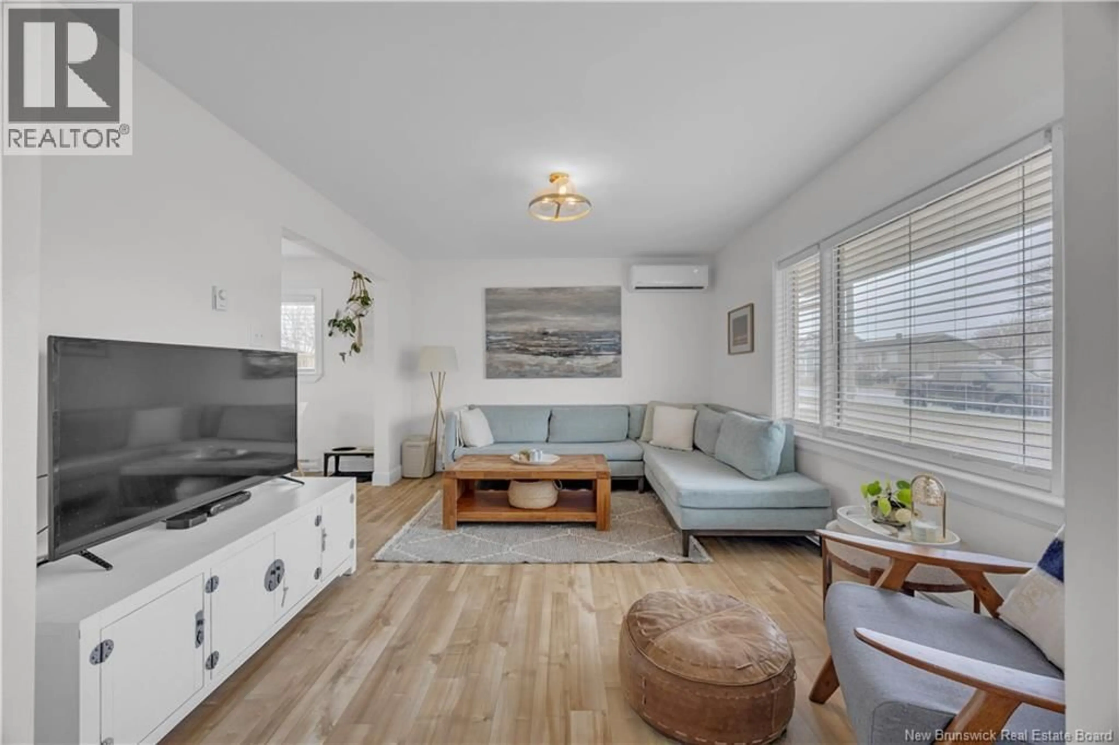Living room with furniture, wood/laminate floor for 409 WOODVILLE ROAD, Saint John New Brunswick E2M2H9