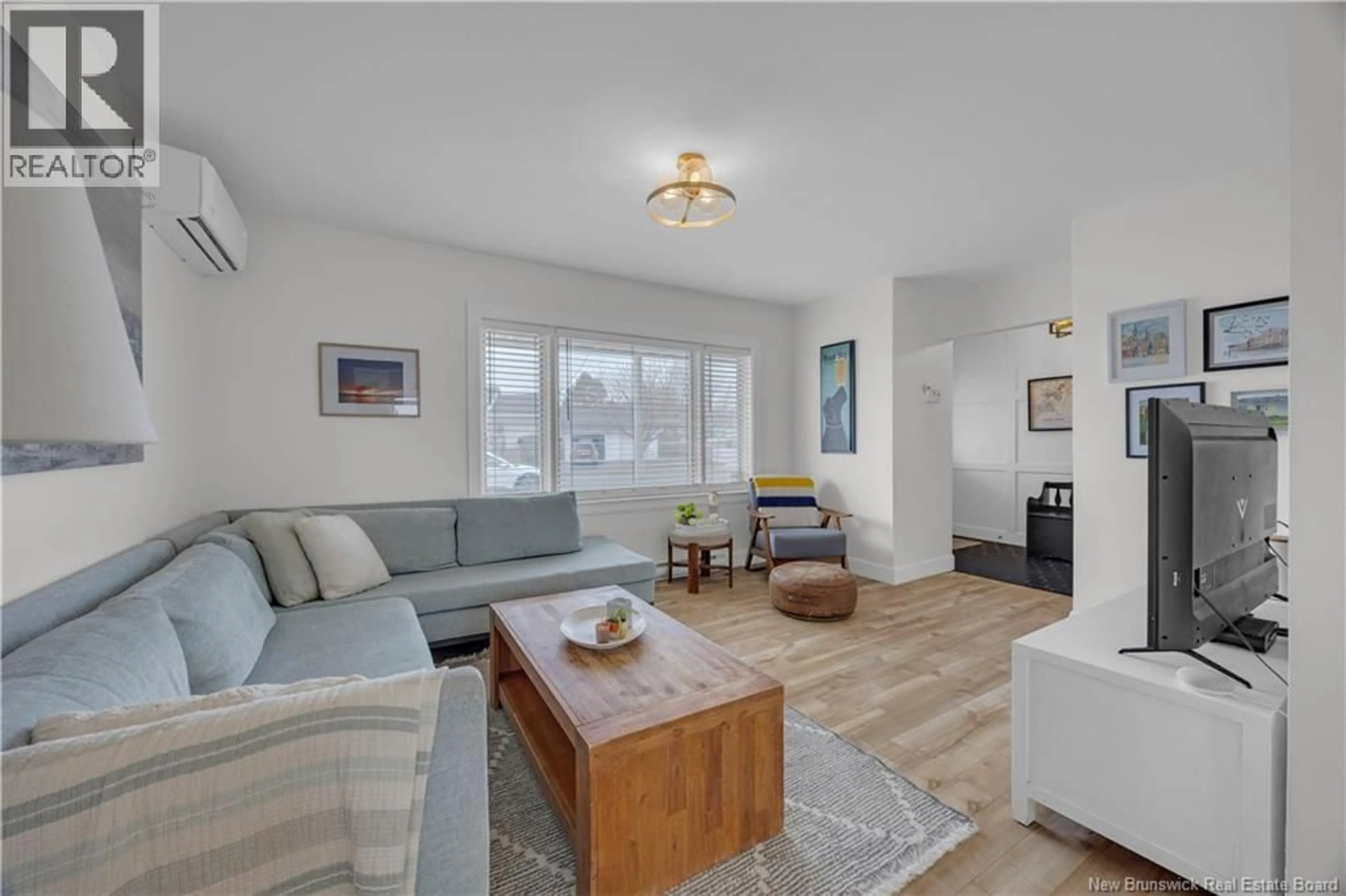 Living room with furniture, wood/laminate floor for 409 WOODVILLE ROAD, Saint John New Brunswick E2M2H9