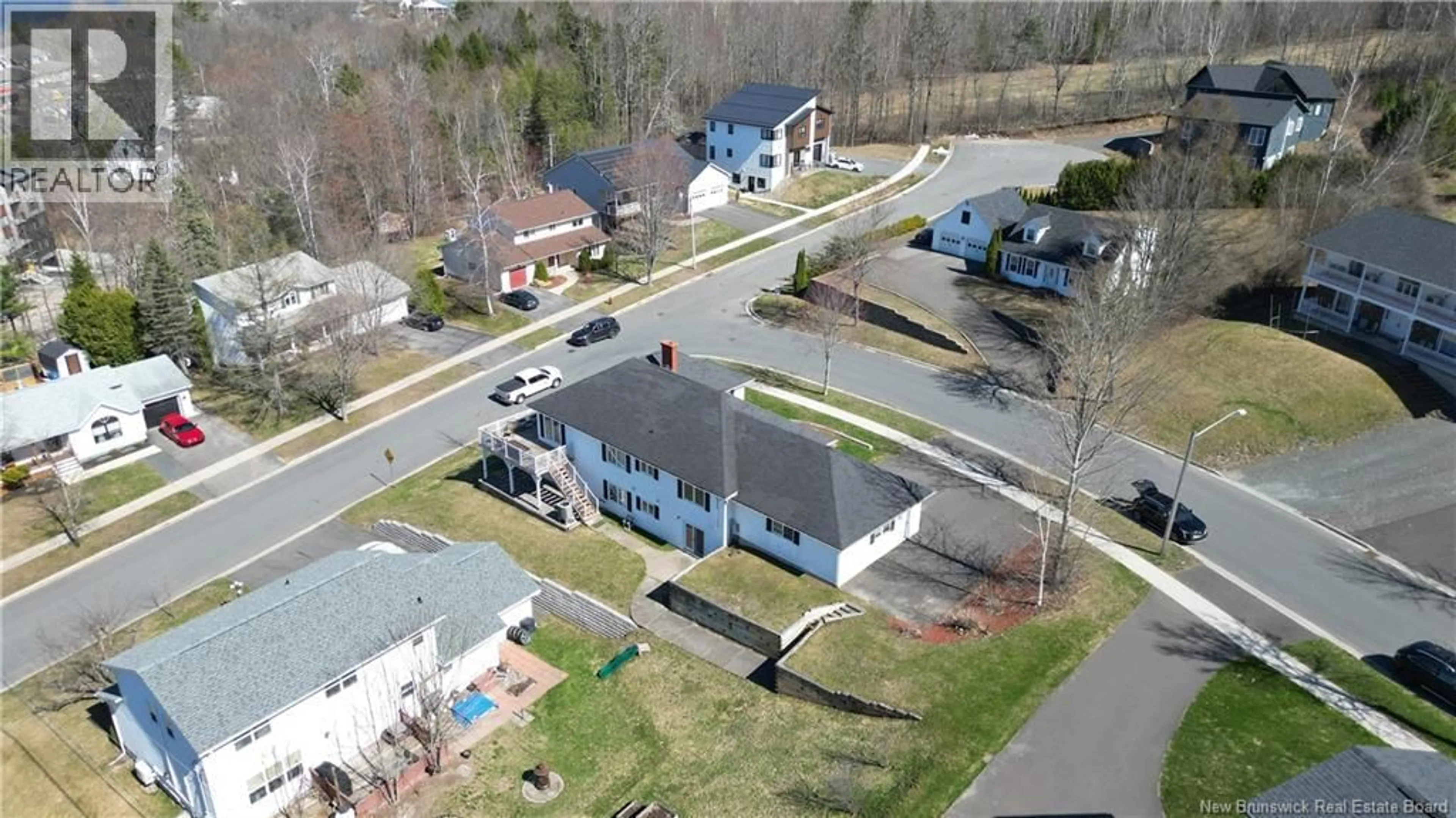 A pic from outside/outdoor area/front of a property/back of a property/a pic from drone, street for 15 TALISMAN CRESCENT, Fredericton New Brunswick E3C1L9