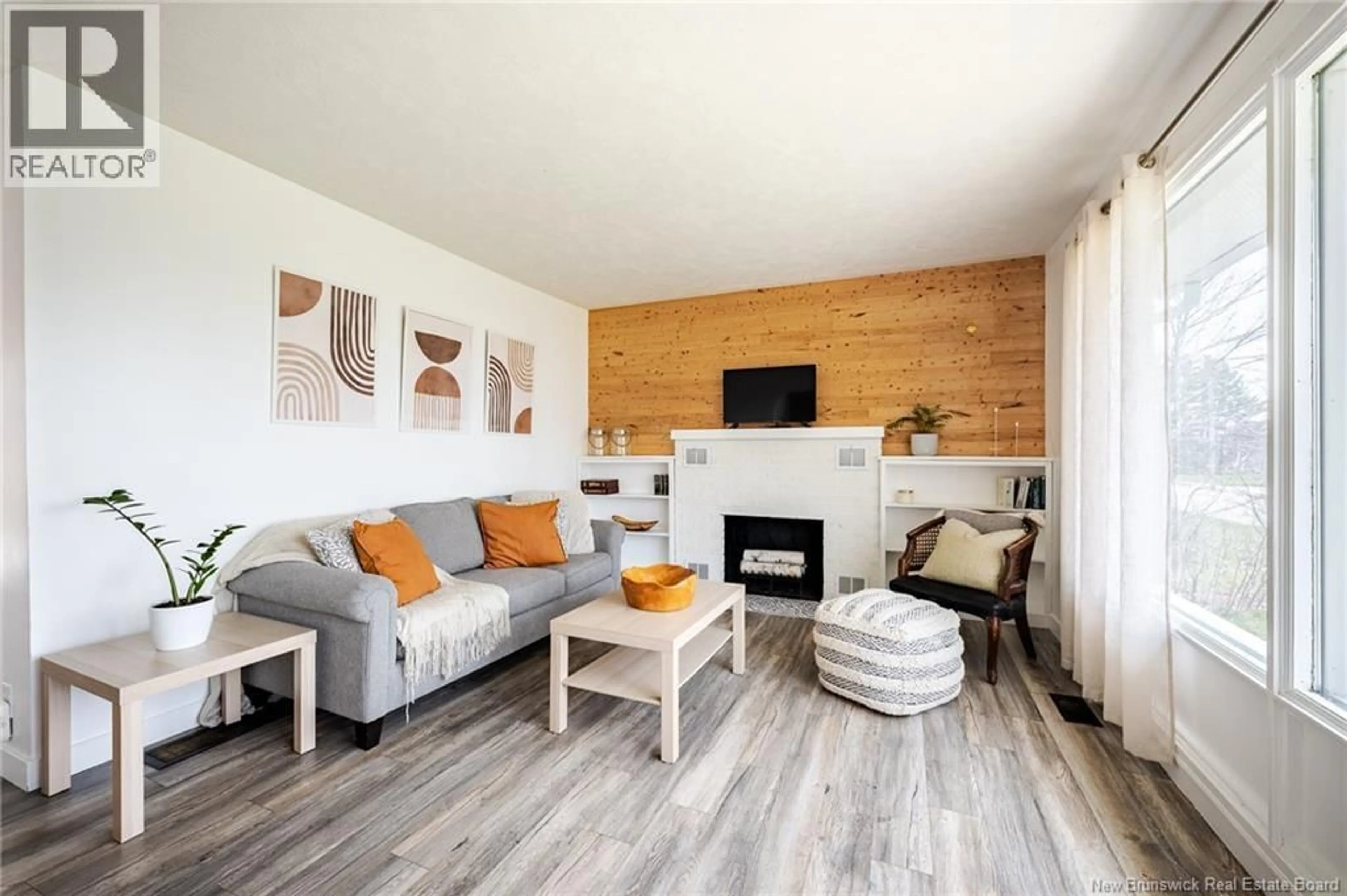 Living room with furniture, wood/laminate floor for 565 HILLCREST DRIVE, Fredericton New Brunswick E3A2X8