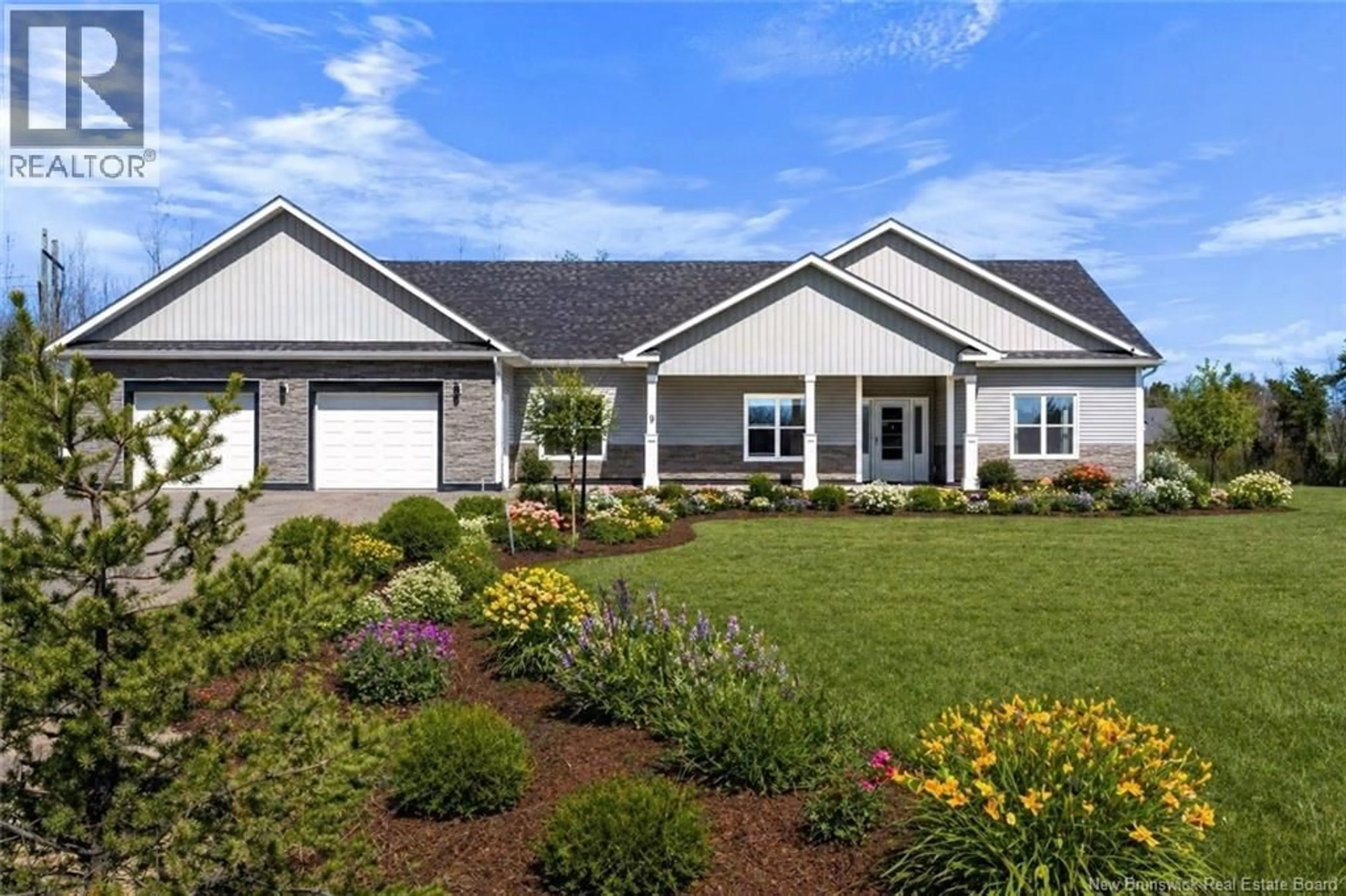 Home with vinyl exterior material, street for 9 FLYNN STREET, Pine Glen New Brunswick E1J0H5