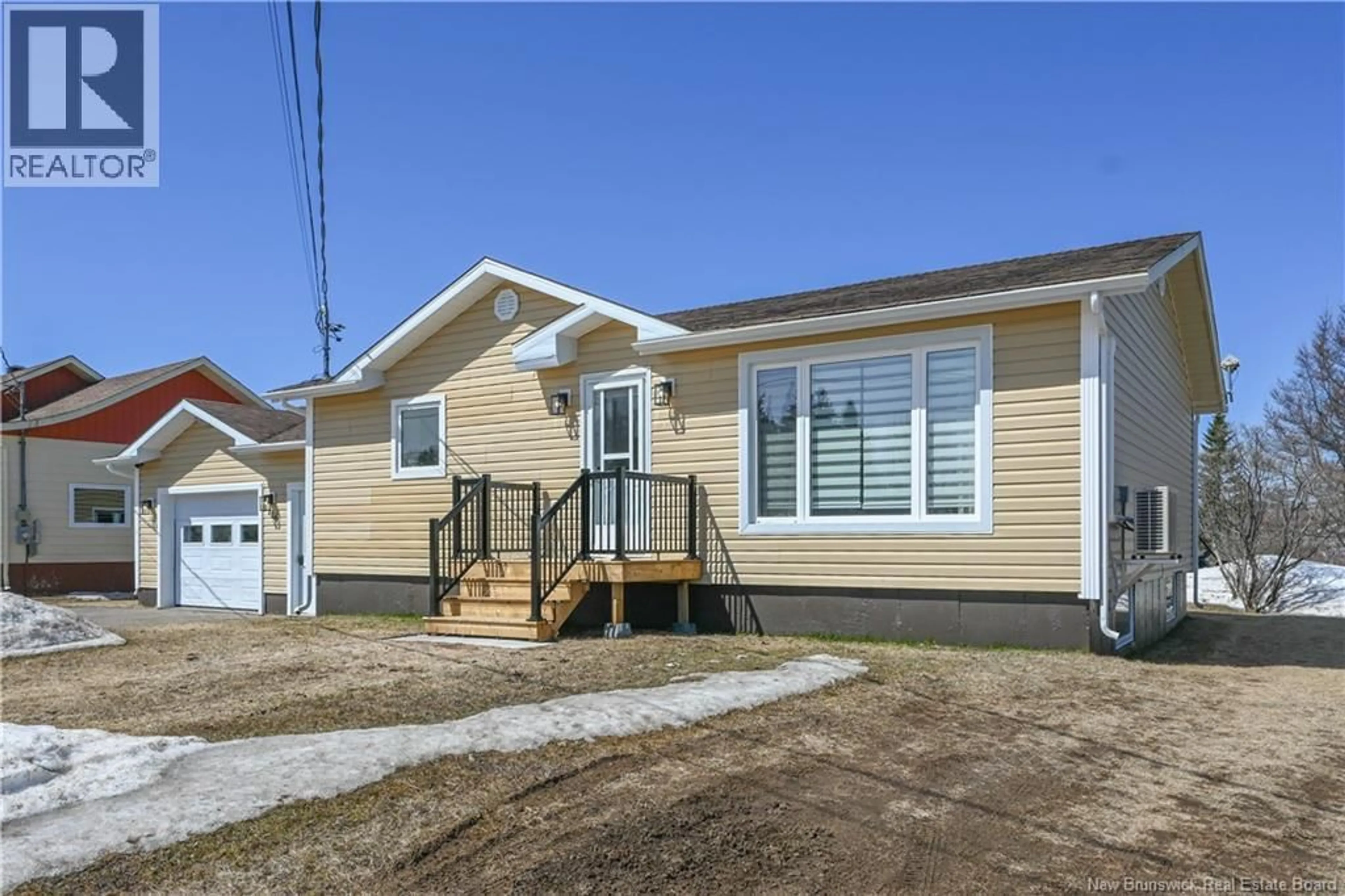Home with vinyl exterior material, street for 106 DES CHAMPS STREET, Lamèque New Brunswick E8T1E7